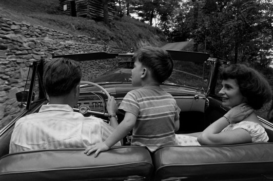 Billy Graham, his son, Franklin, and his wife, Ruth, in a car, 1955.