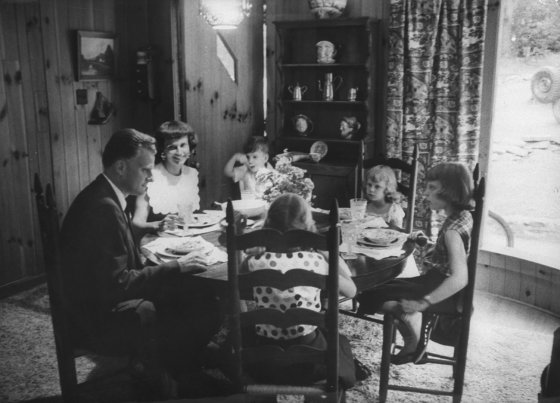 Billy Graham and family at a meal, 1955.