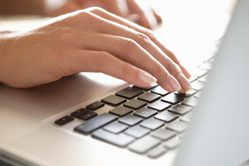close-up-woman-typing-laptop