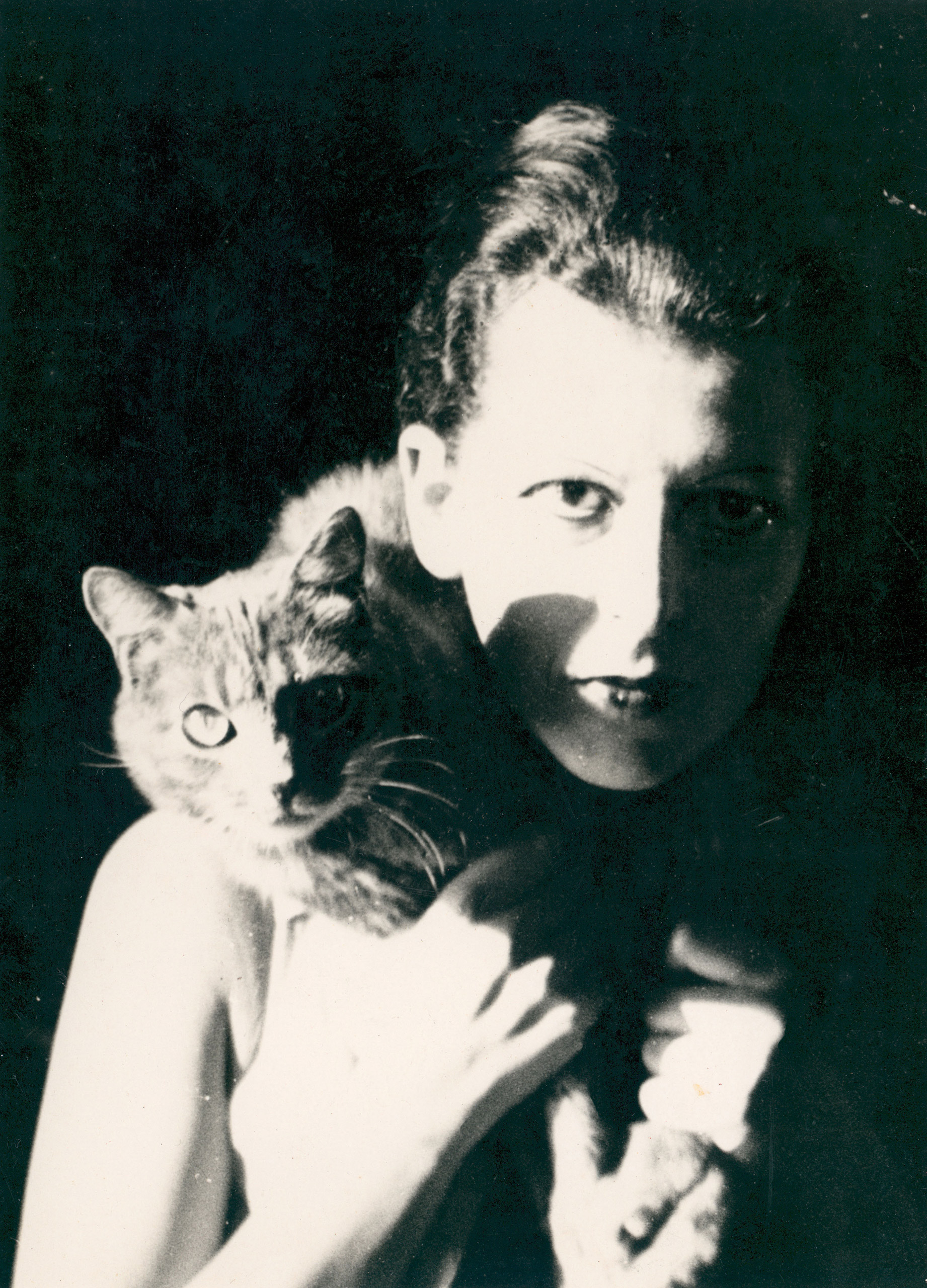 Artist Claude Cahun her cat., 1927.