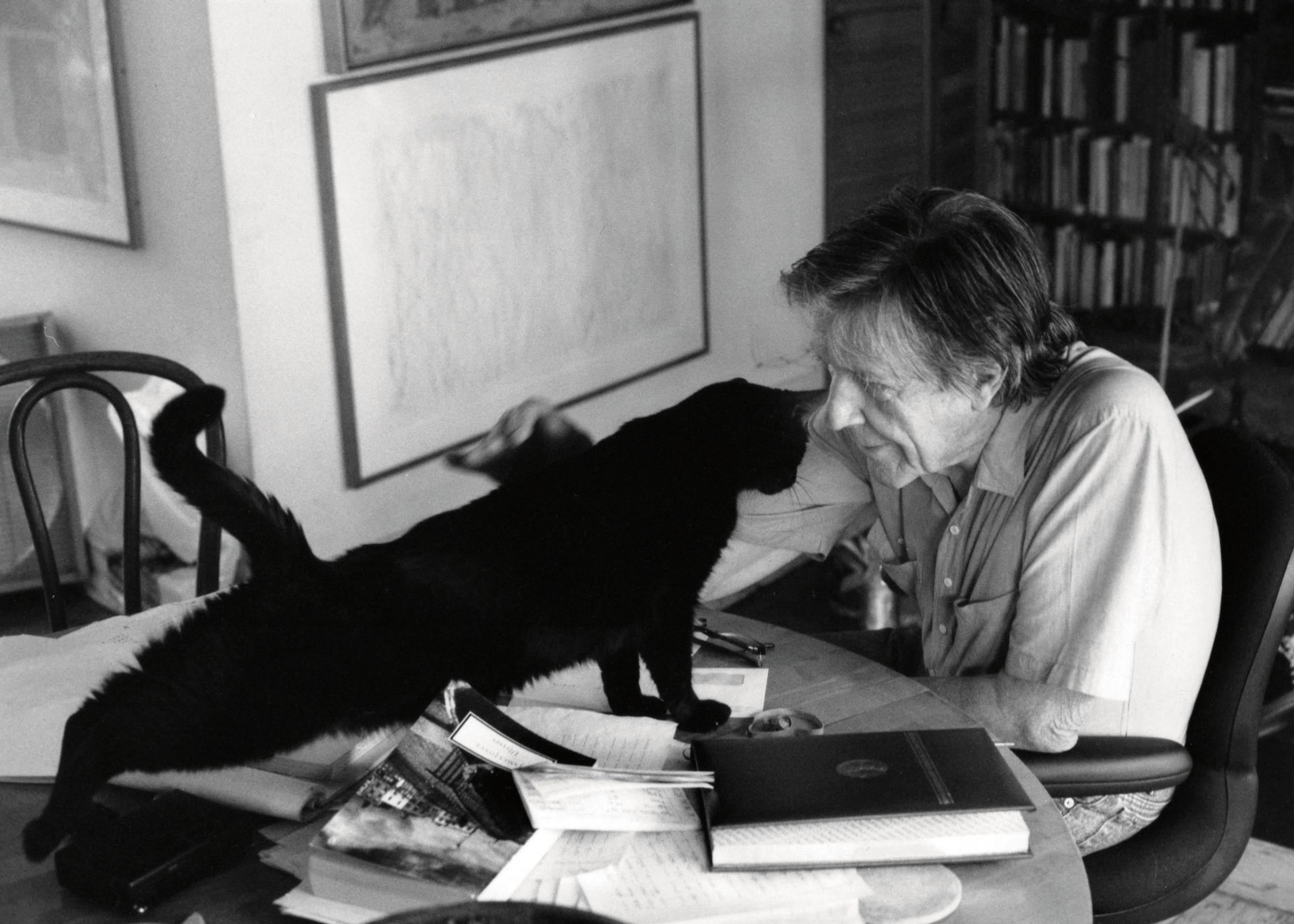 Composer John Cage and his cat.