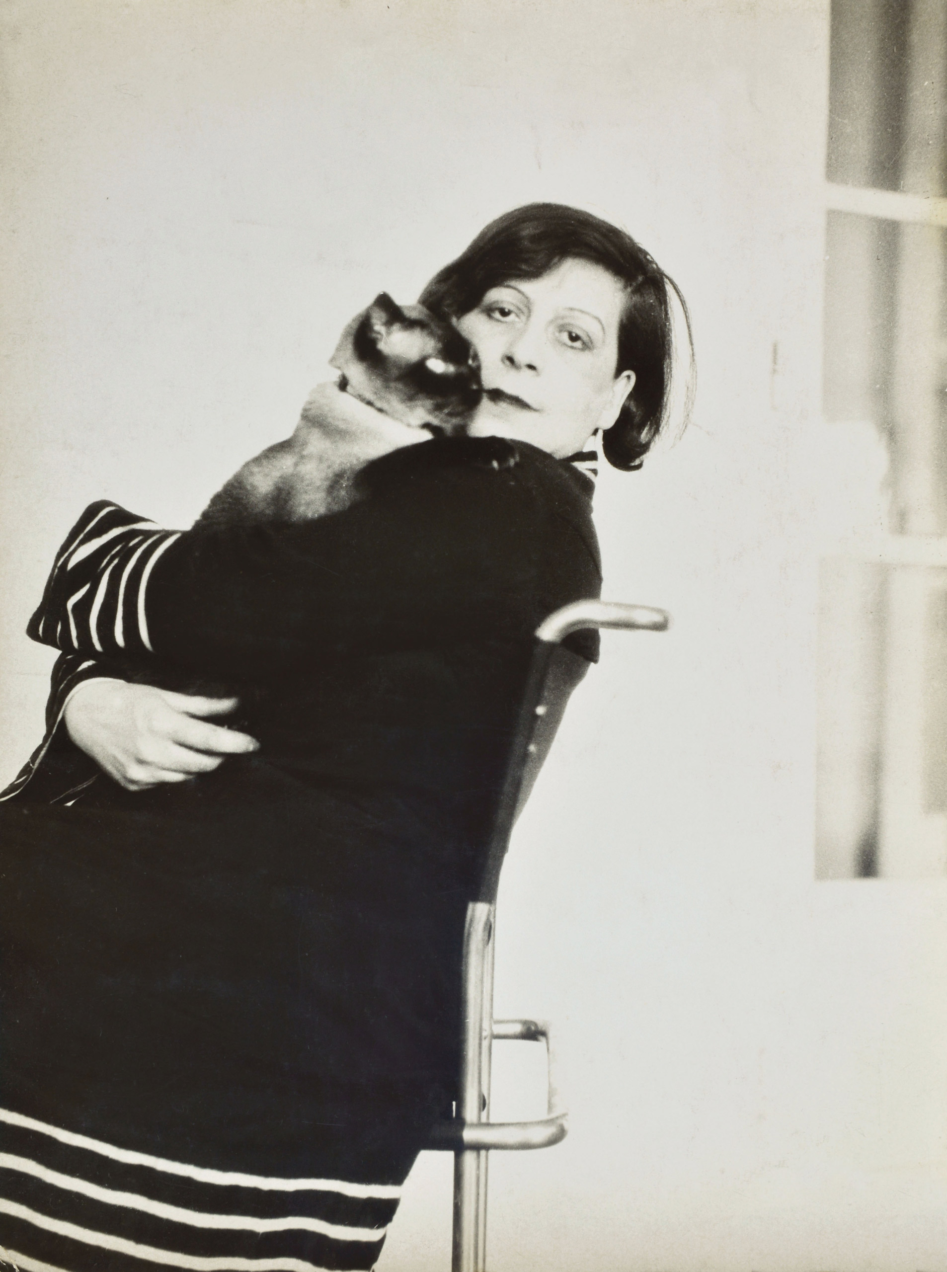 Photographer Florence Henri and her cat.