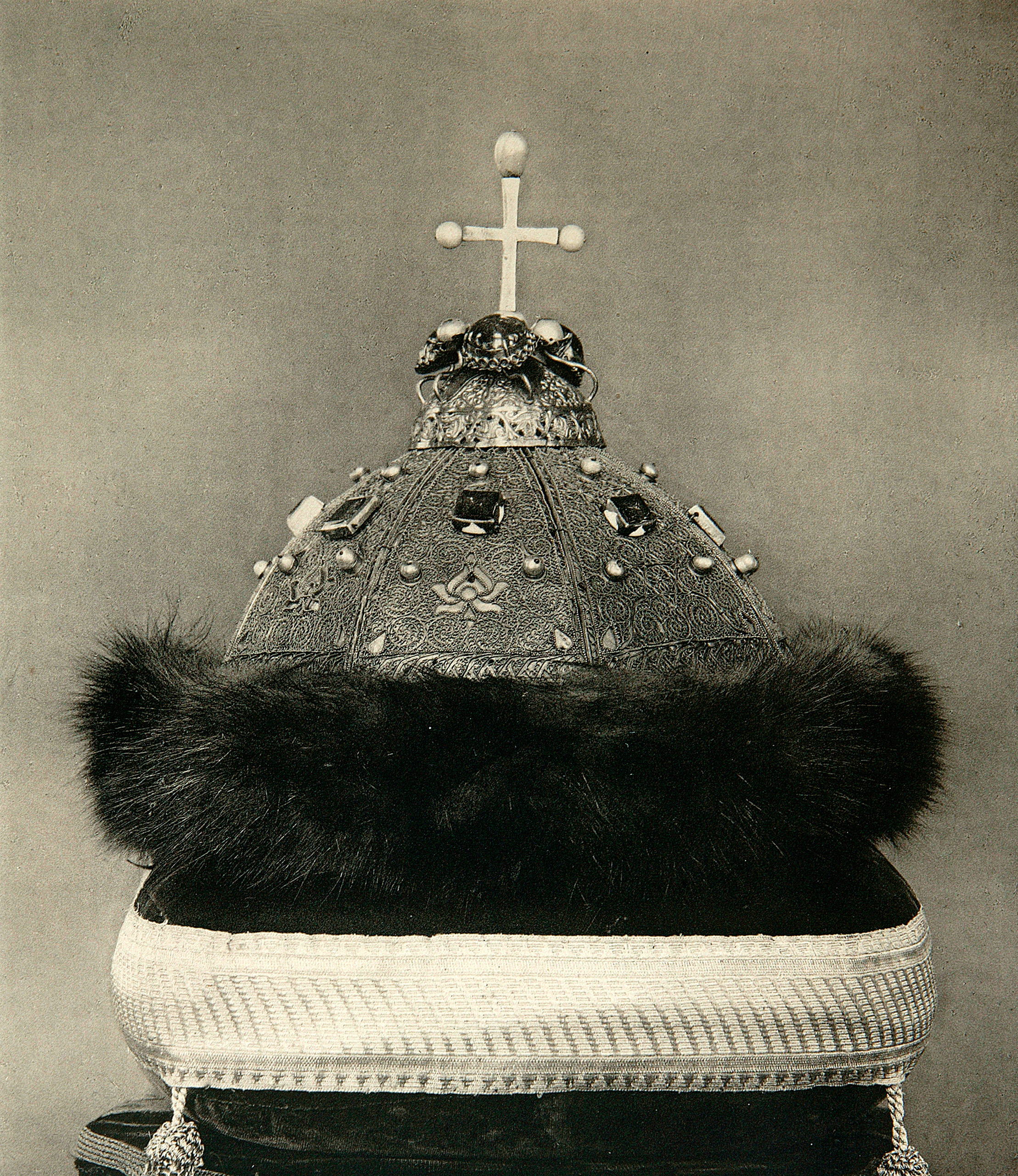 The Monomakh's Cap, before 1884. The Monomakh's Cap was the crown of all Muscovite Grand Princes and Tsars from Dmitri Donskoi to Peter the Great, who replaced it with the Imperial Crown of Russia in 1721. A skullcap decorated with precious stones and pea.