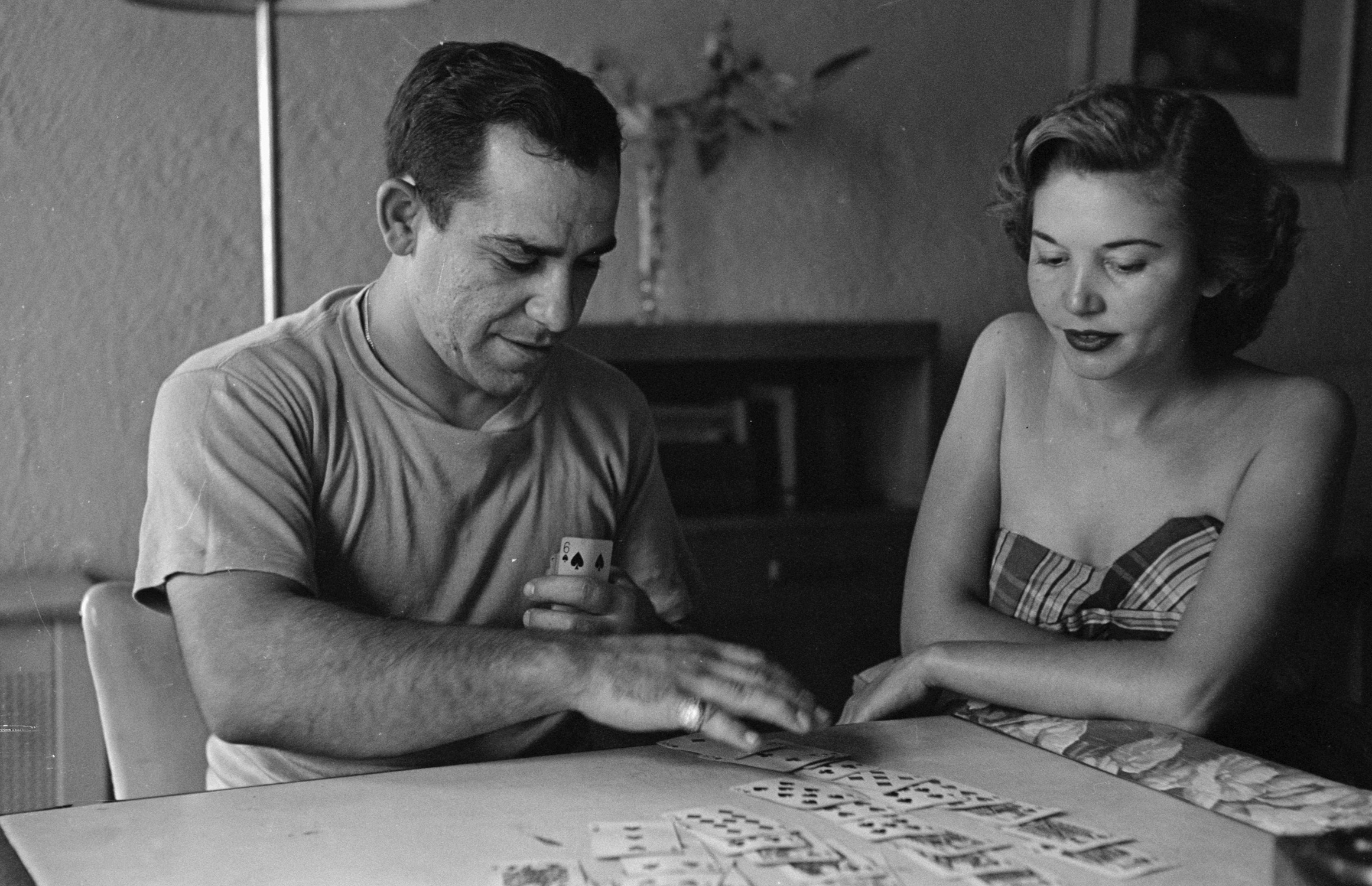 Yogi Berra playing cards with his wife, Carmen, 1949.