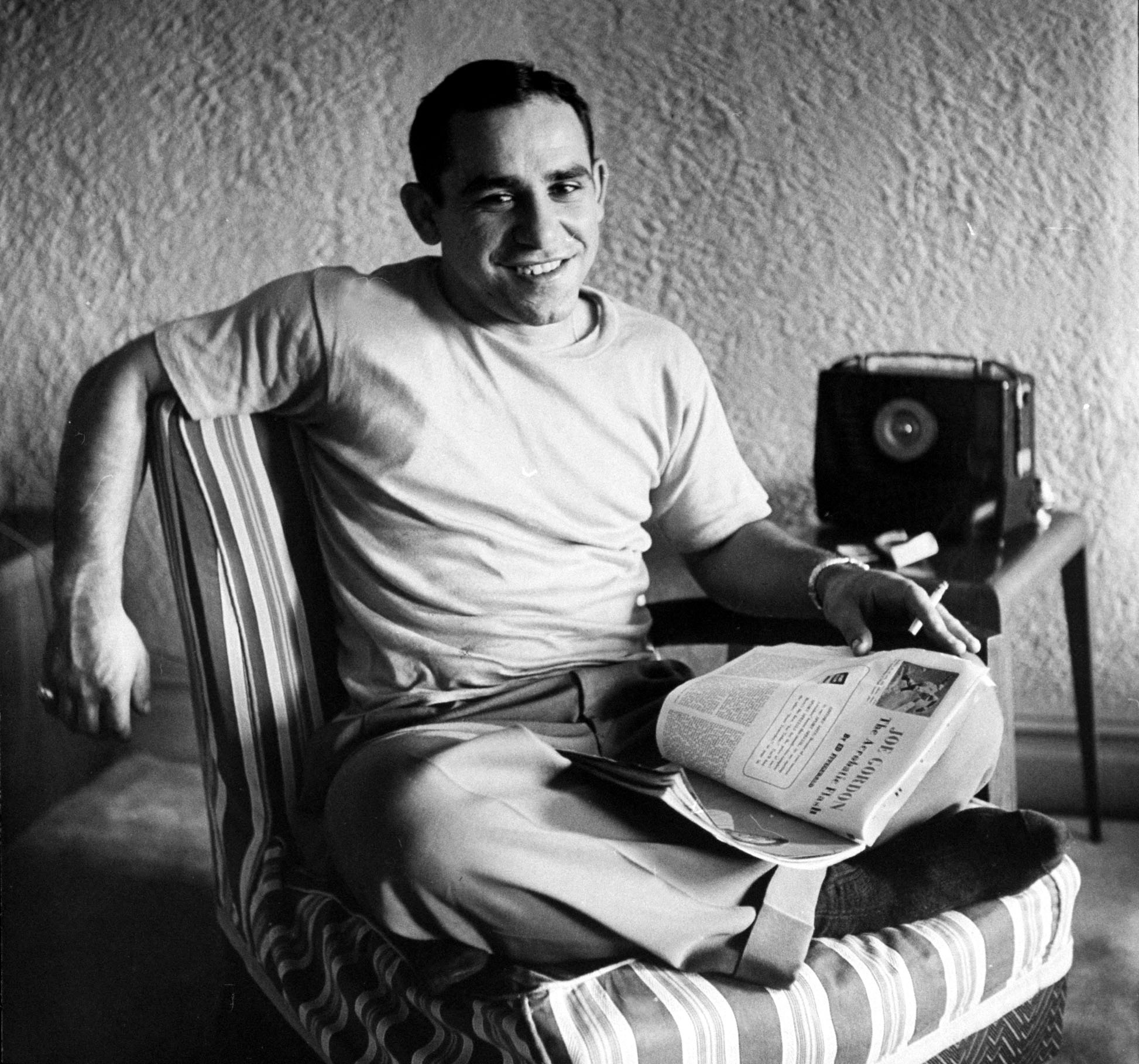 Baseball player Yogi Berra relaxing at home, 1949.