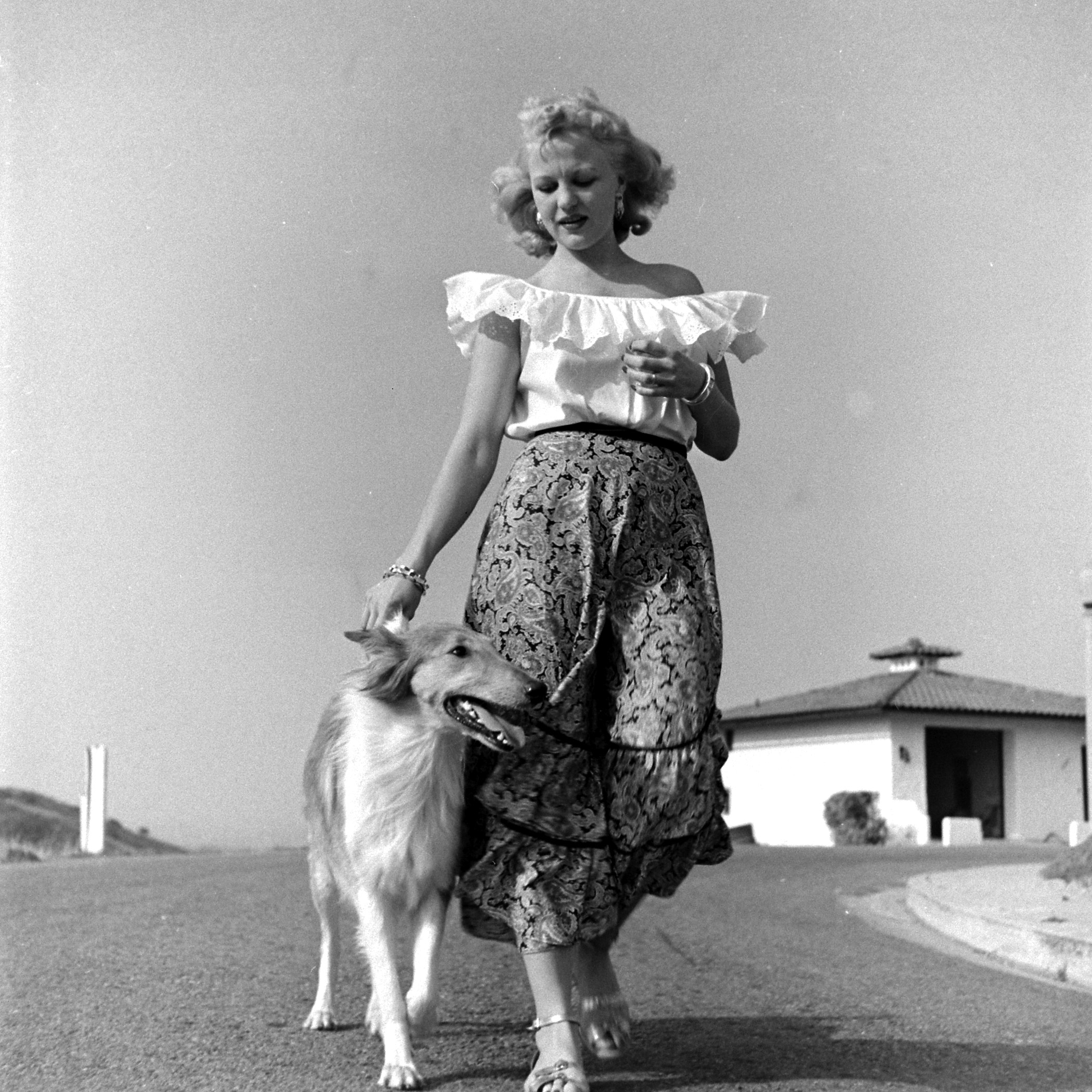 Peggy Lee and her dog Banjo at home in California, 1948.