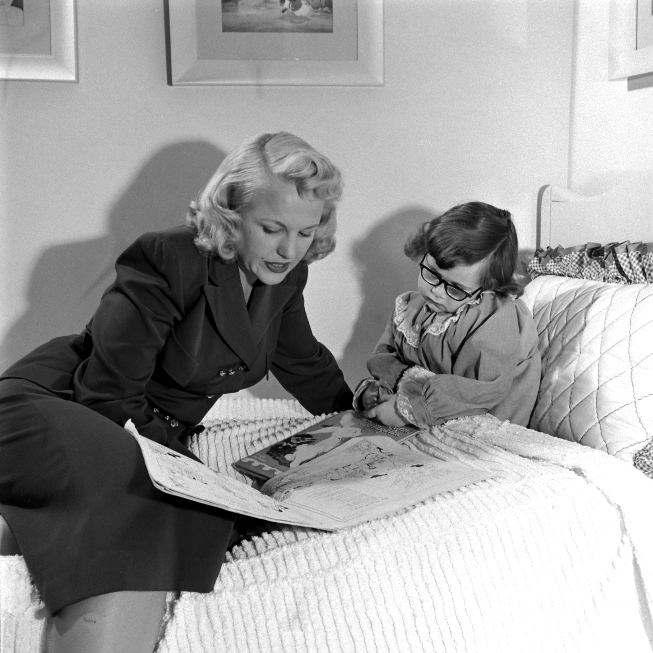 Peggy Lee reading to her daughter Nicki, at home in California, 1948.