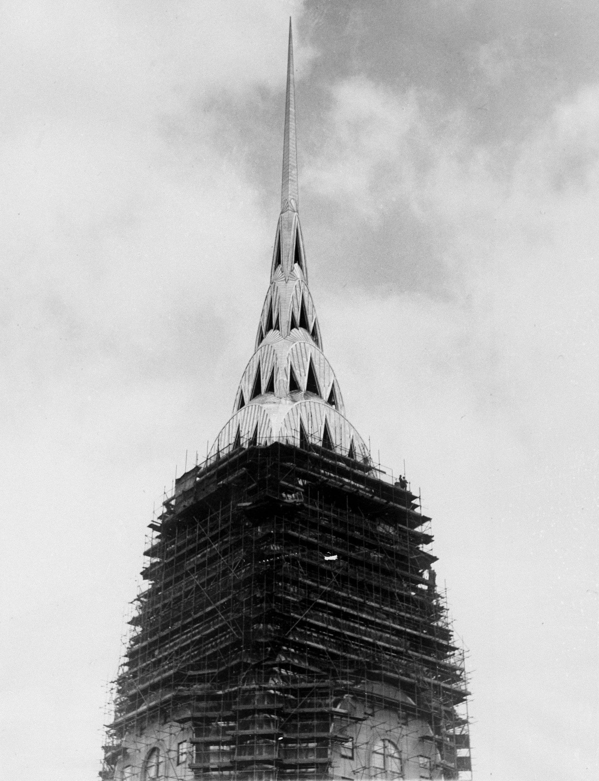 The sharp, glistening spire of the Chrysler Building stands revealed as the world's tallest building sheds its scaffolding, May 26, 1930.