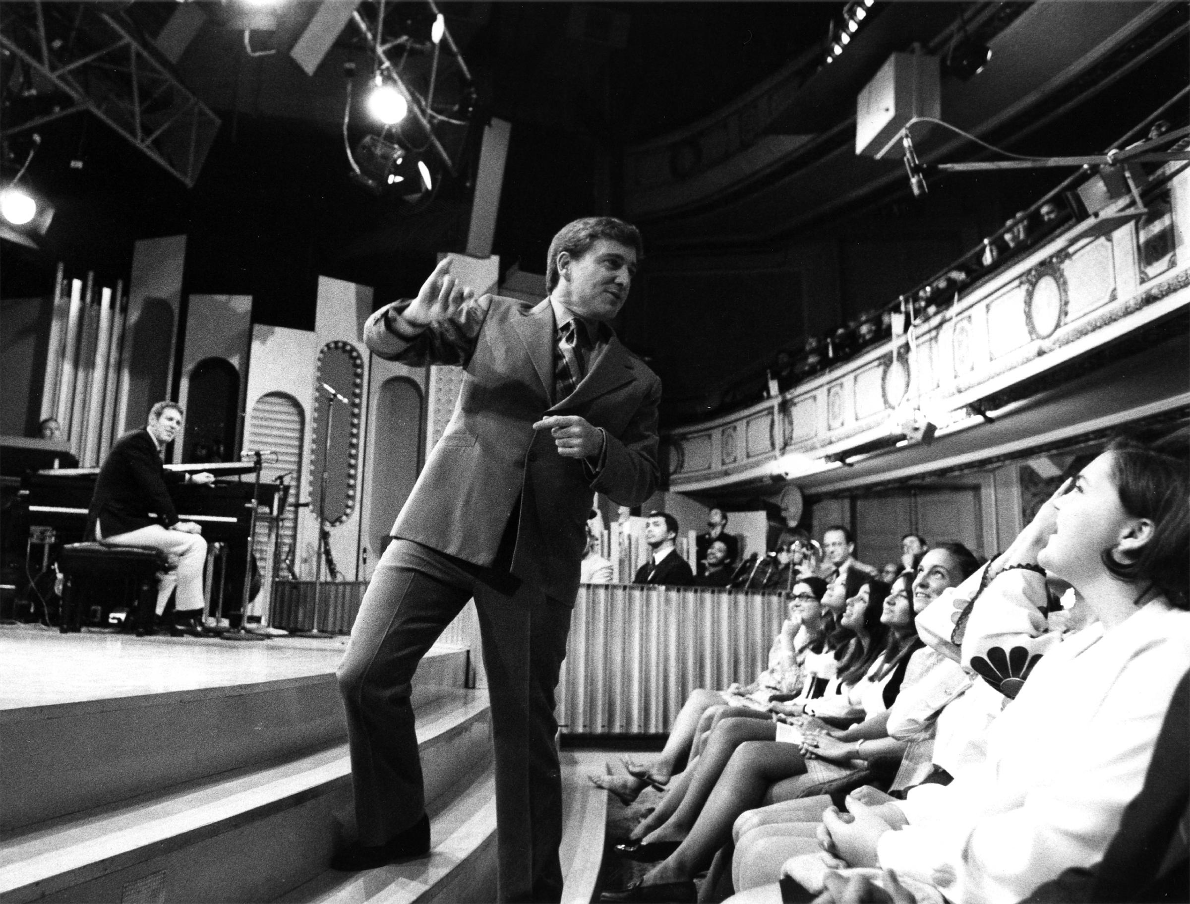 Merv Griffin warming up the audience before the show, 1969.