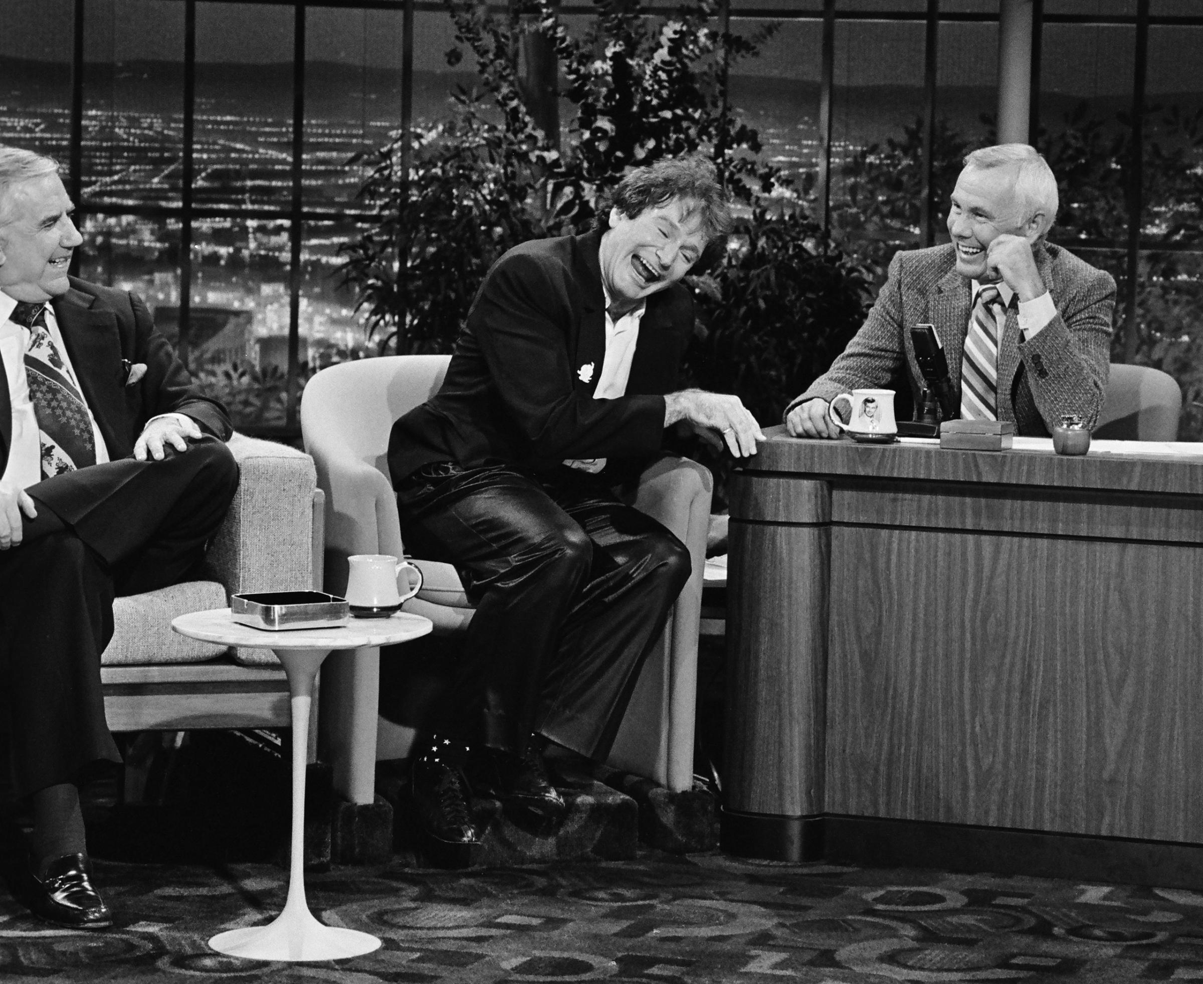 The Tonight Show starring Johnny Carson: (l-r) Announcer Ed McMahon, Actor/comedian Robin Williams, host Johnny Carson on October 14, 1981.