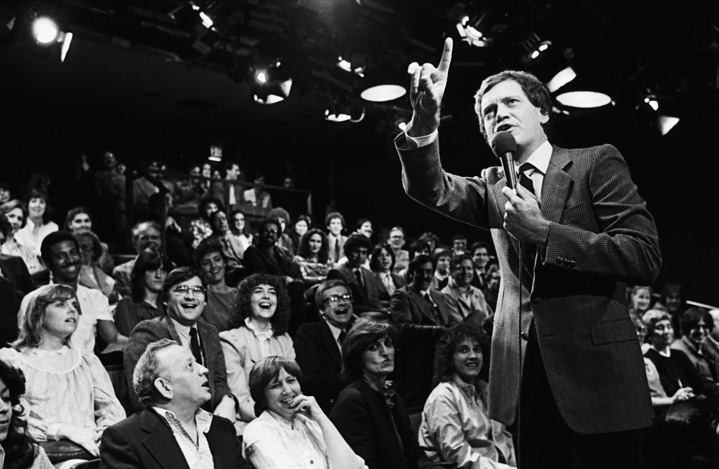 Comedian and late night television host, David Letterman, warms up his NBC studio audience prior to the taping of his popular 1982 New York, NY, television show at Rockefeller Center, 1982.