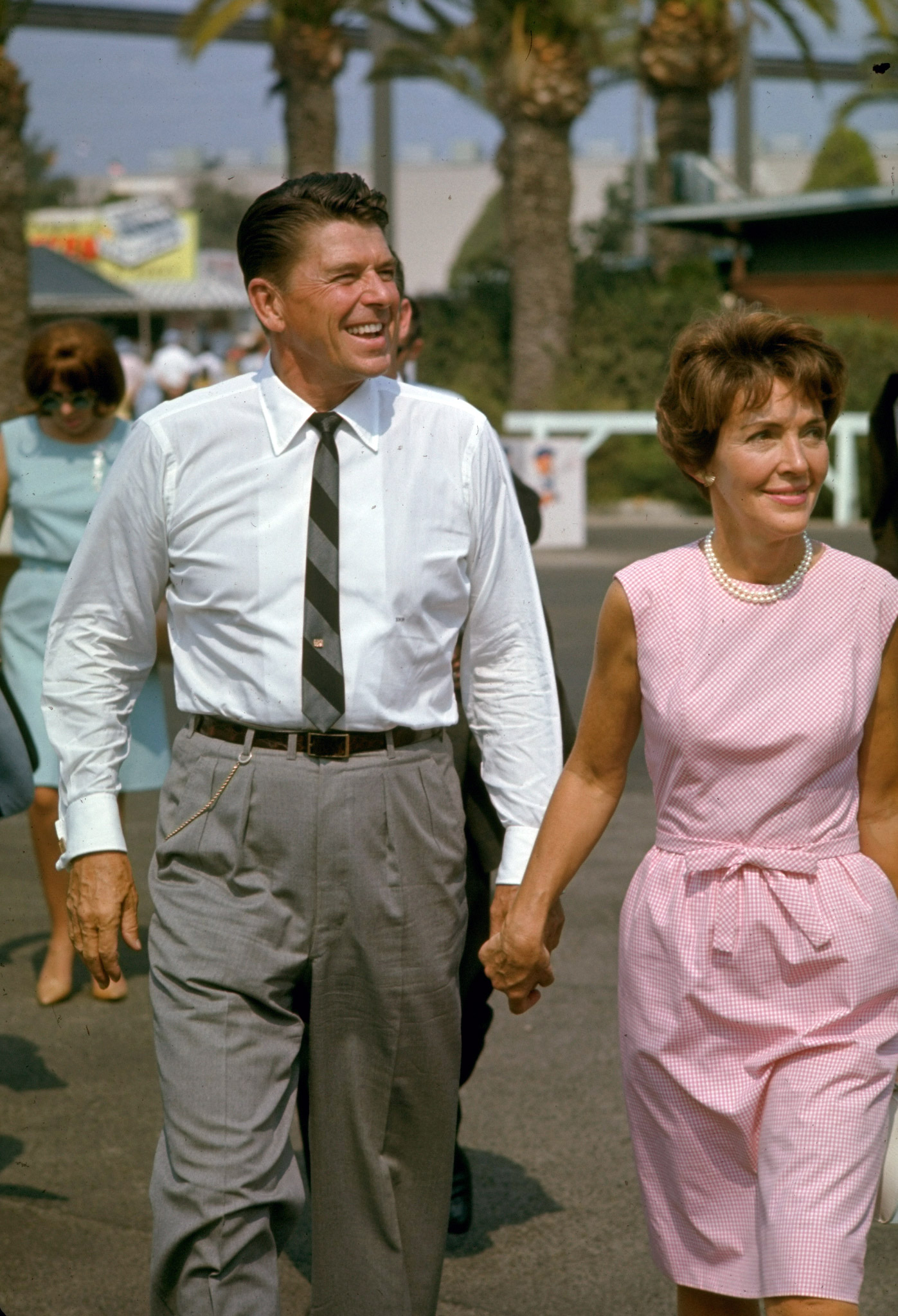 California gubernatorial candidate Ronald Reagan holding hands with wife Nancy while on the campaign trail, 1966.