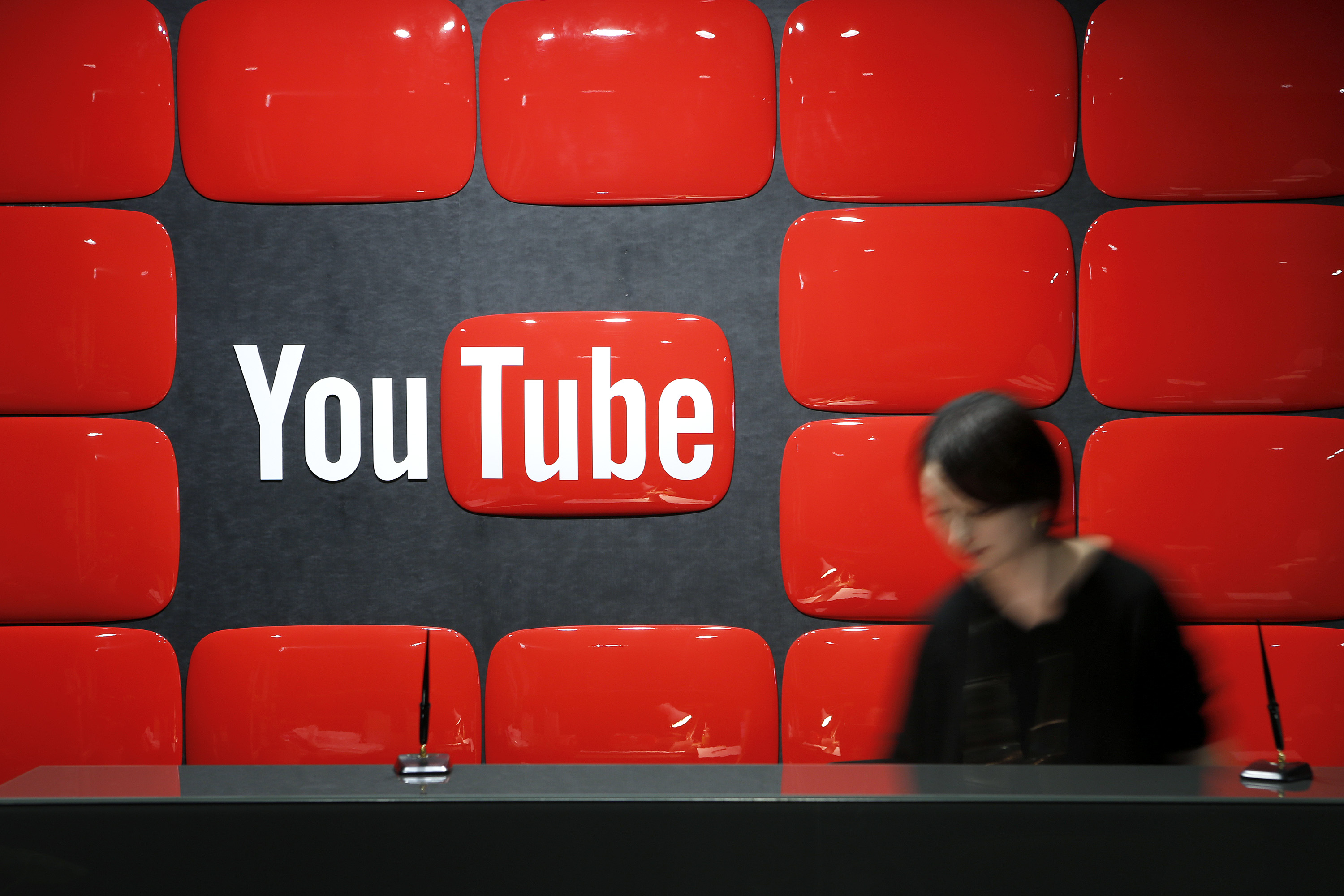Google Inc.'s YouTube logo is displayed behind the reception desk at the company's YouTube Space studio in Tokyo, Japan, on Saturday, March 30, 2013. (Bloomberg&mdash;Bloomberg via Getty Images)