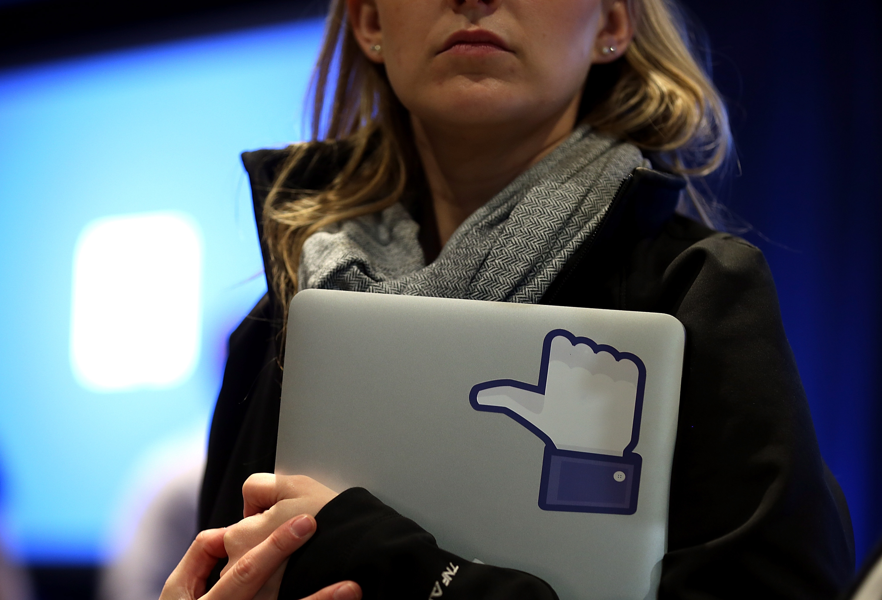 A Facebook employee holds a laptop with a "like" sticker on it during an event at Facebook headquarters during an event at Facebook headquarters on April 4, 2013 in Menlo Park, California. (Justin Sullivan&mdash;Getty Images)
