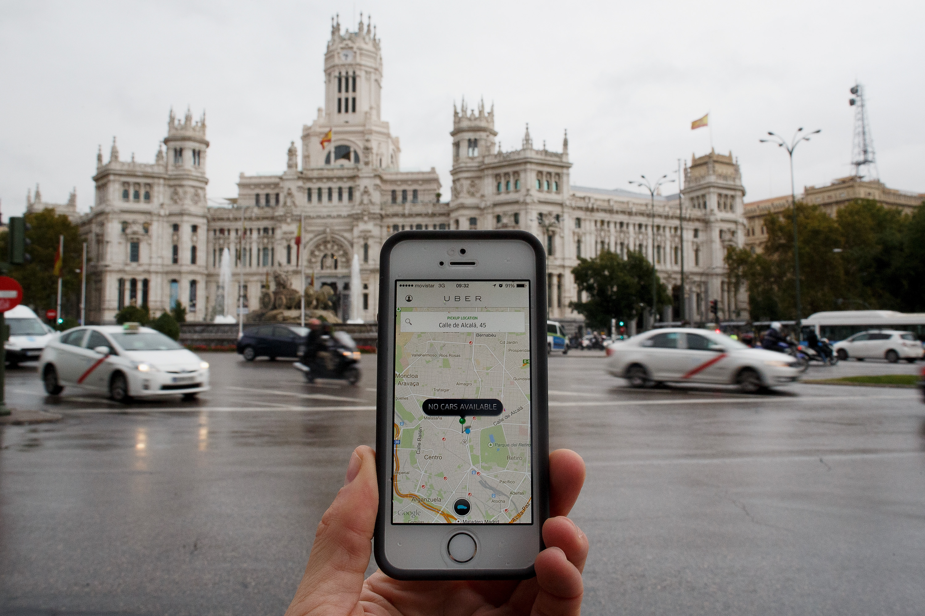 In this photo illustration the smart phone taxi app 'Uber' shows how to select a pick up location at Cibeles Square on October 14, 2014 in Madrid, Spain. (Pablo Blazquez Dominguez—Getty Images)