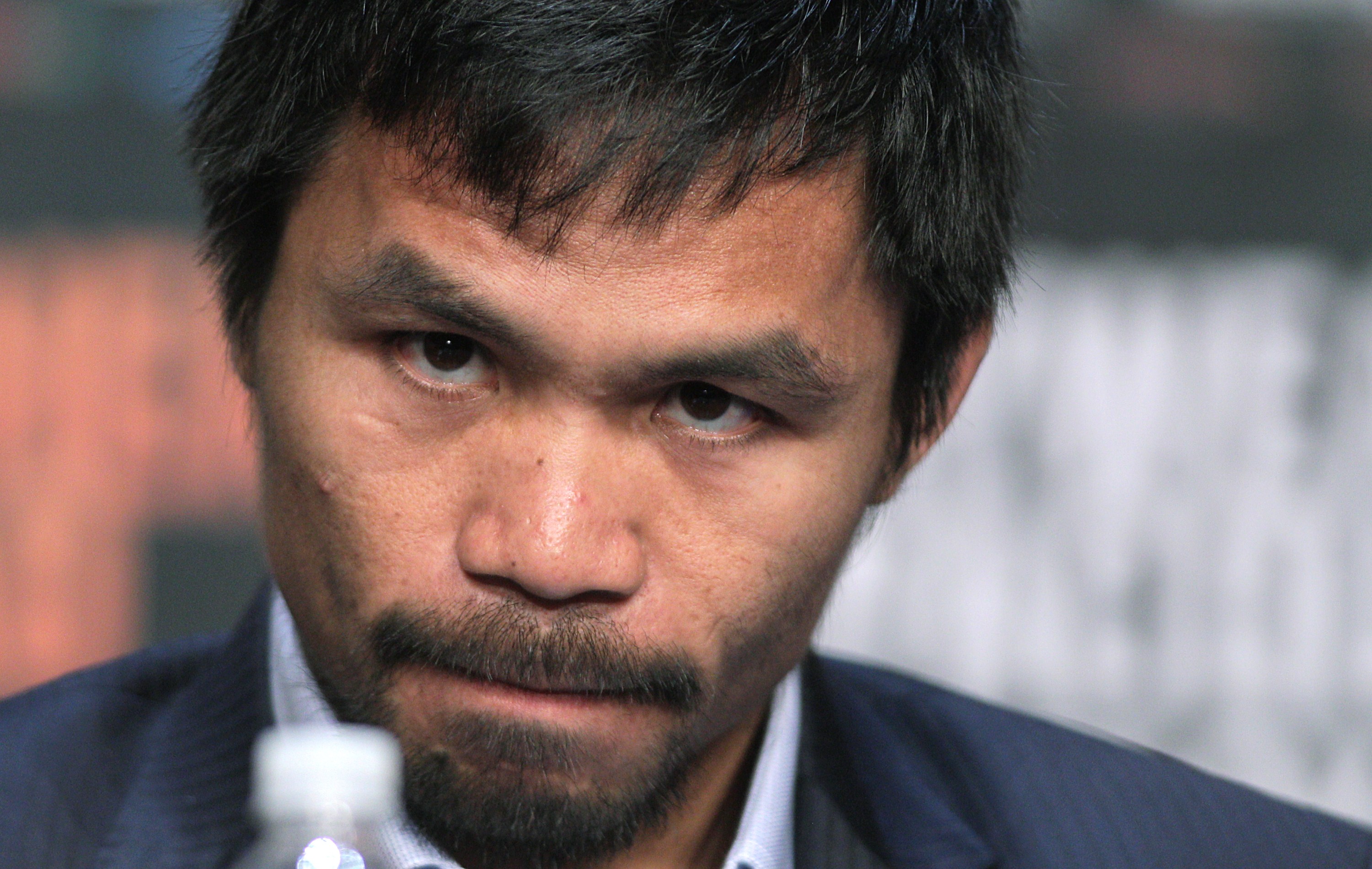 WBO welterweight champion Manny Pacquiao  listens during a news conference at the KA Theatre at MGM Grand Hotel &amp; Casino on April 29, 2015 in Las Vegas, Nevada. (JOHN GURZINSKI—AFP/Getty Images)