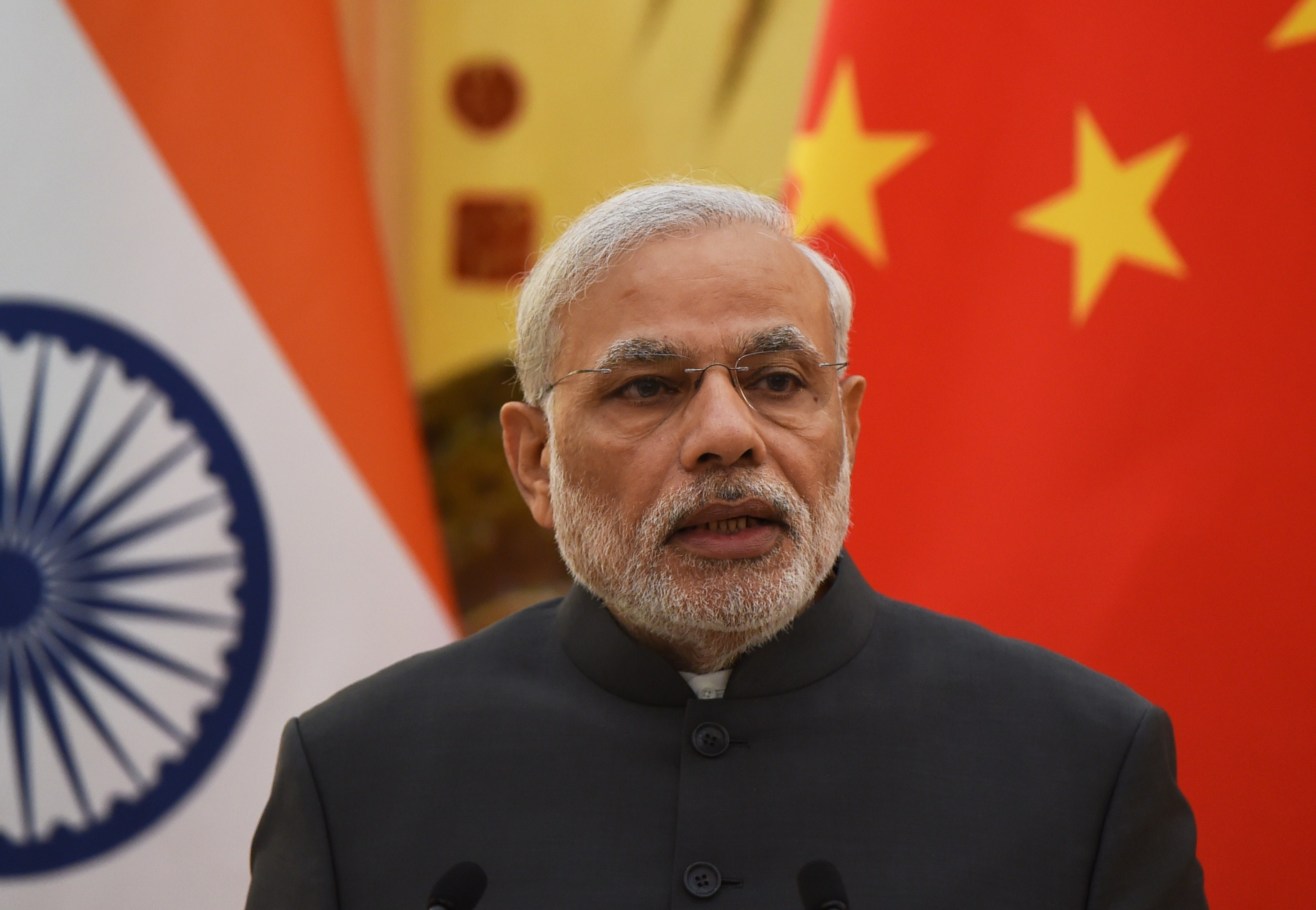 India's Prime Minister Narendra Modi speaks at a joint press conference with Chinese Premier Li Keqiang (not seen) in the Great Hall of the People in Beijing on May 15, 2015 (GREG BAKER—AFP/Getty Images)