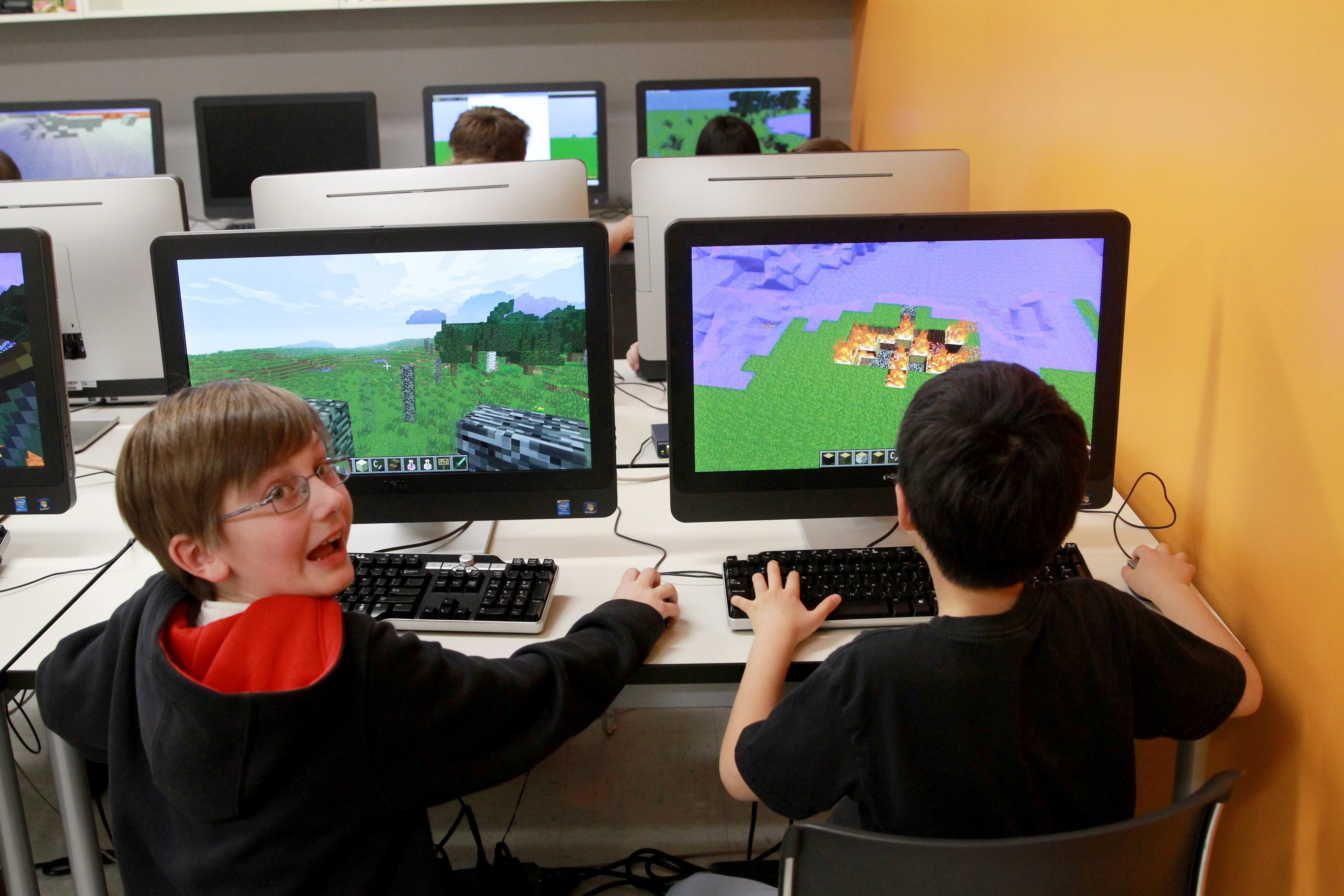 Bobby Craig, left, and Doogy Lee create worlds in Minecraft that parallel what they have bene reading in "The Hobbit" as part of their fifth grade class studies at Quest Academy in Palatine, Ill. (Chicago Tribune&mdash;MCT via Getty Images)