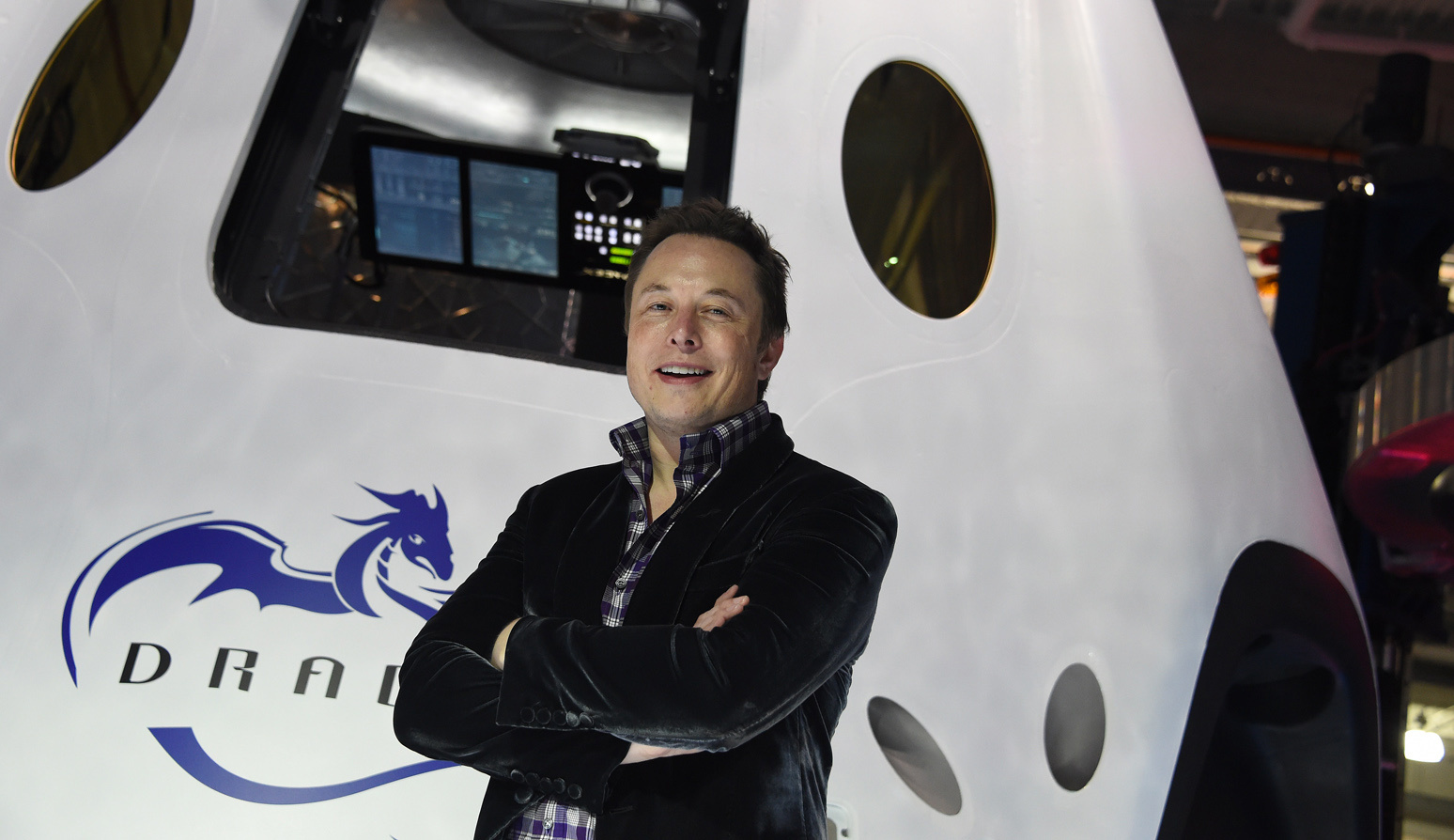 SpaceX CEO Elon Musk introduces SpaceX's Dragon V2 spacecraft, the company's next generation version of the Dragon ship designed  to carry astronauts into space, at a press conference in Hawthorne, Calif. on May 29, 2014. (Robyn Beck—AFP/Getty Images)