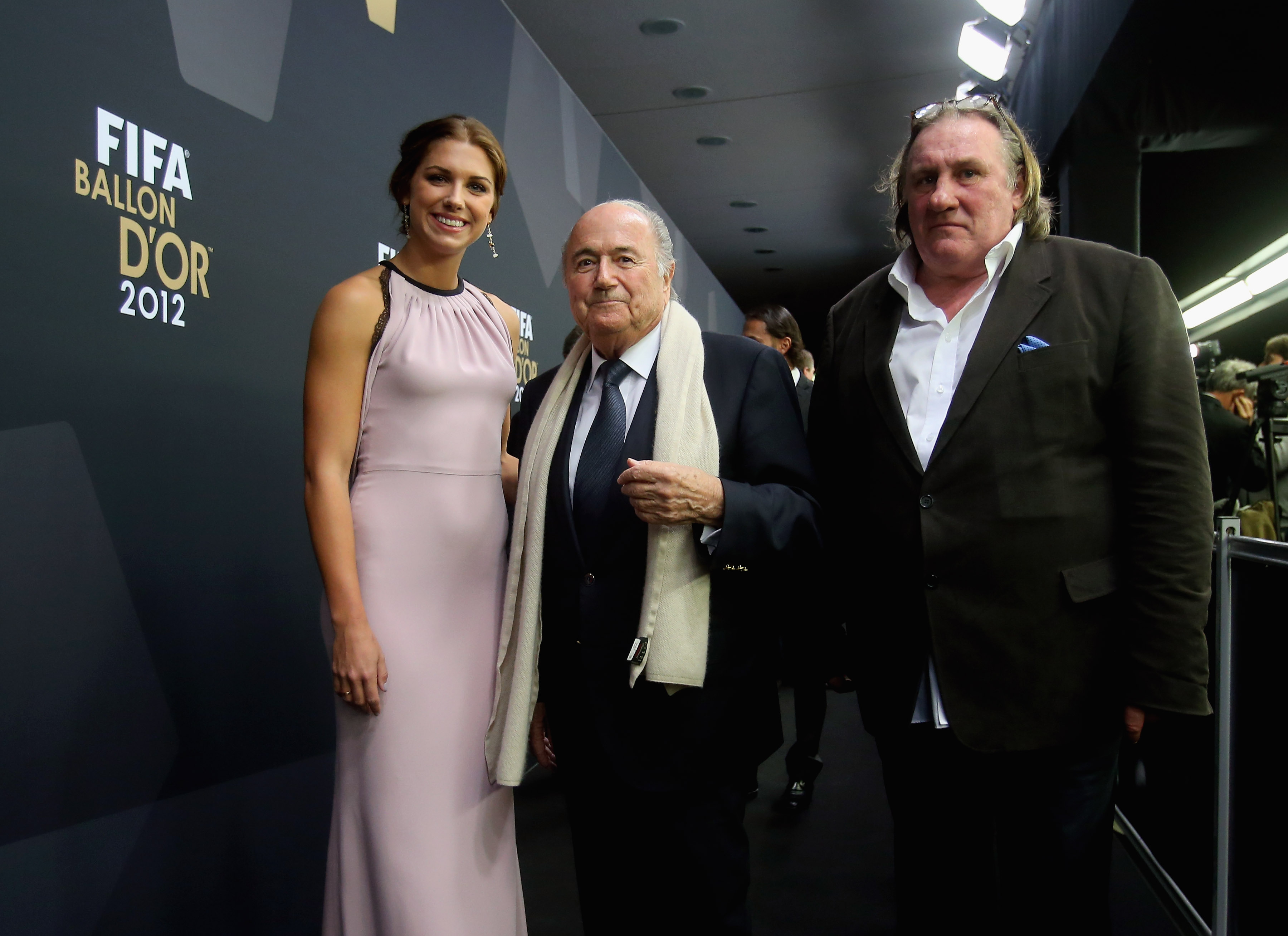 FIFA president Joseph S. Blatter, Alex Morgan and  French actor Gerard Depardieu during the red carpet arrivals at the 2012 FIFA Ballon d'Or Gala in Zurich. (Alexander Hassenstein—FIFA via Getty Images)