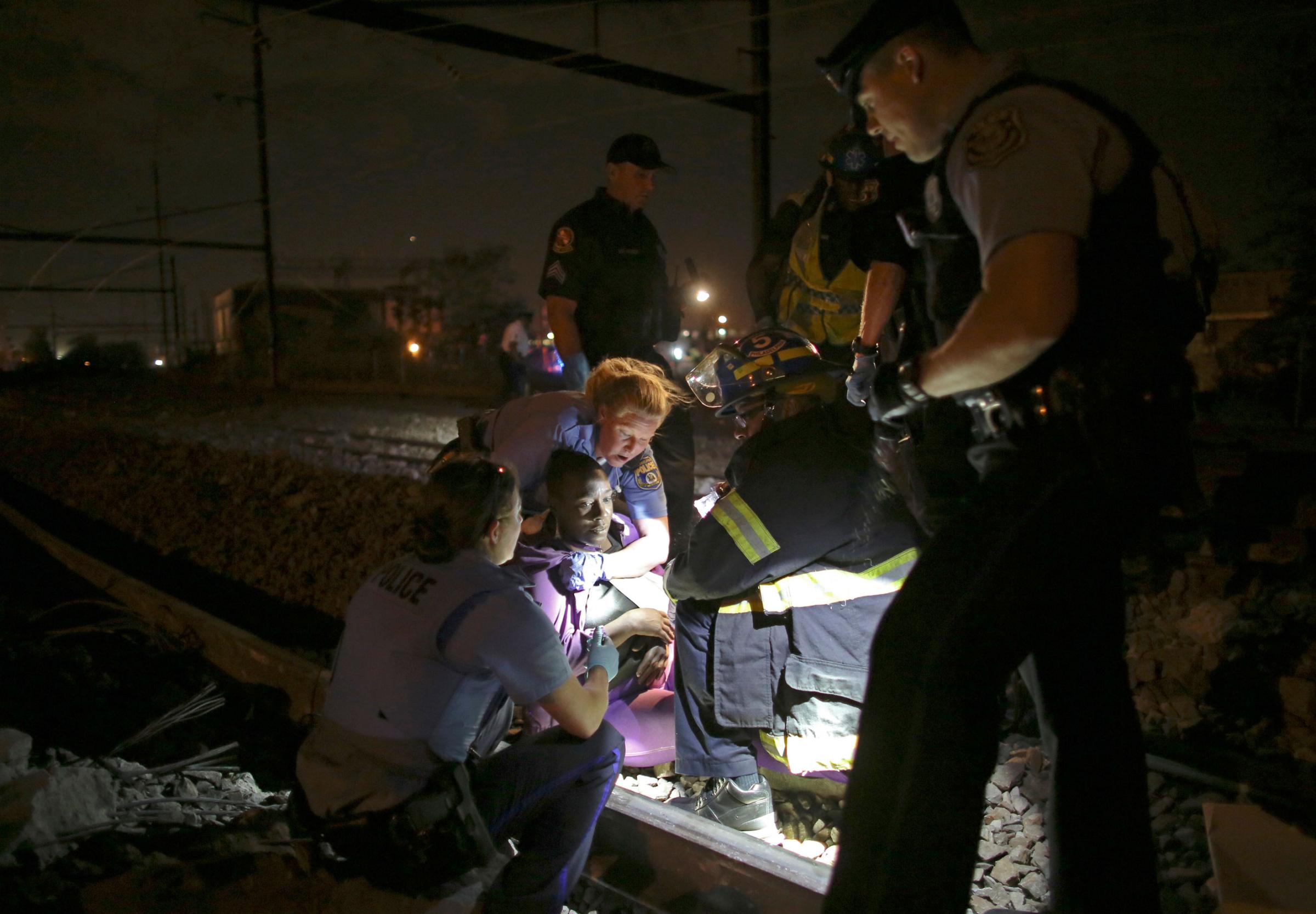 Emergency personnel work the scene of a train wreck on May 12, 2015, in Philadelphia.
