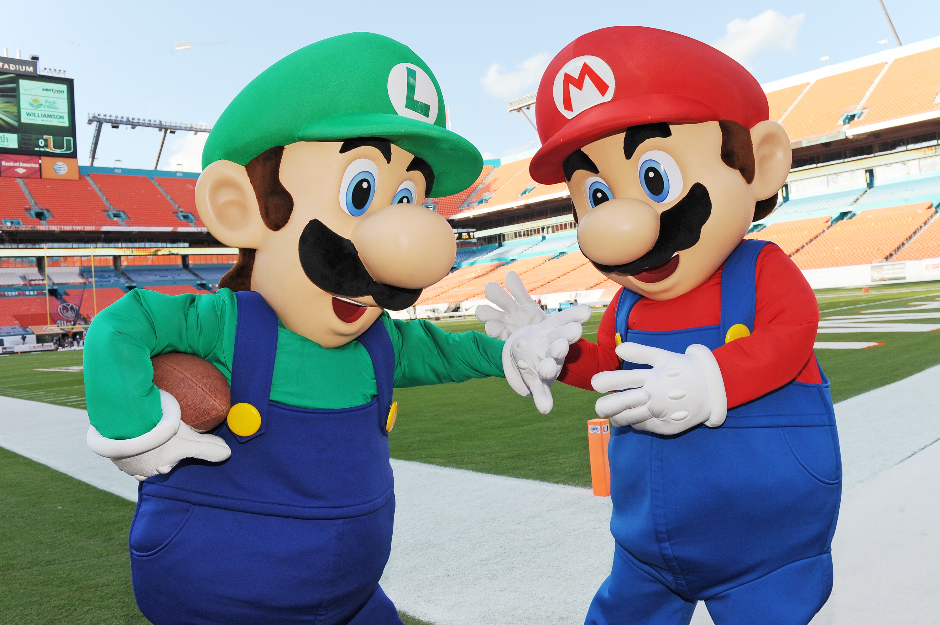 Mario and Luigi take the field at Sun Life Stadium before the face-off between Florida State and University of Miami on Nov. 15, 2014 (Jeff Daly—Invision for Nintendo)