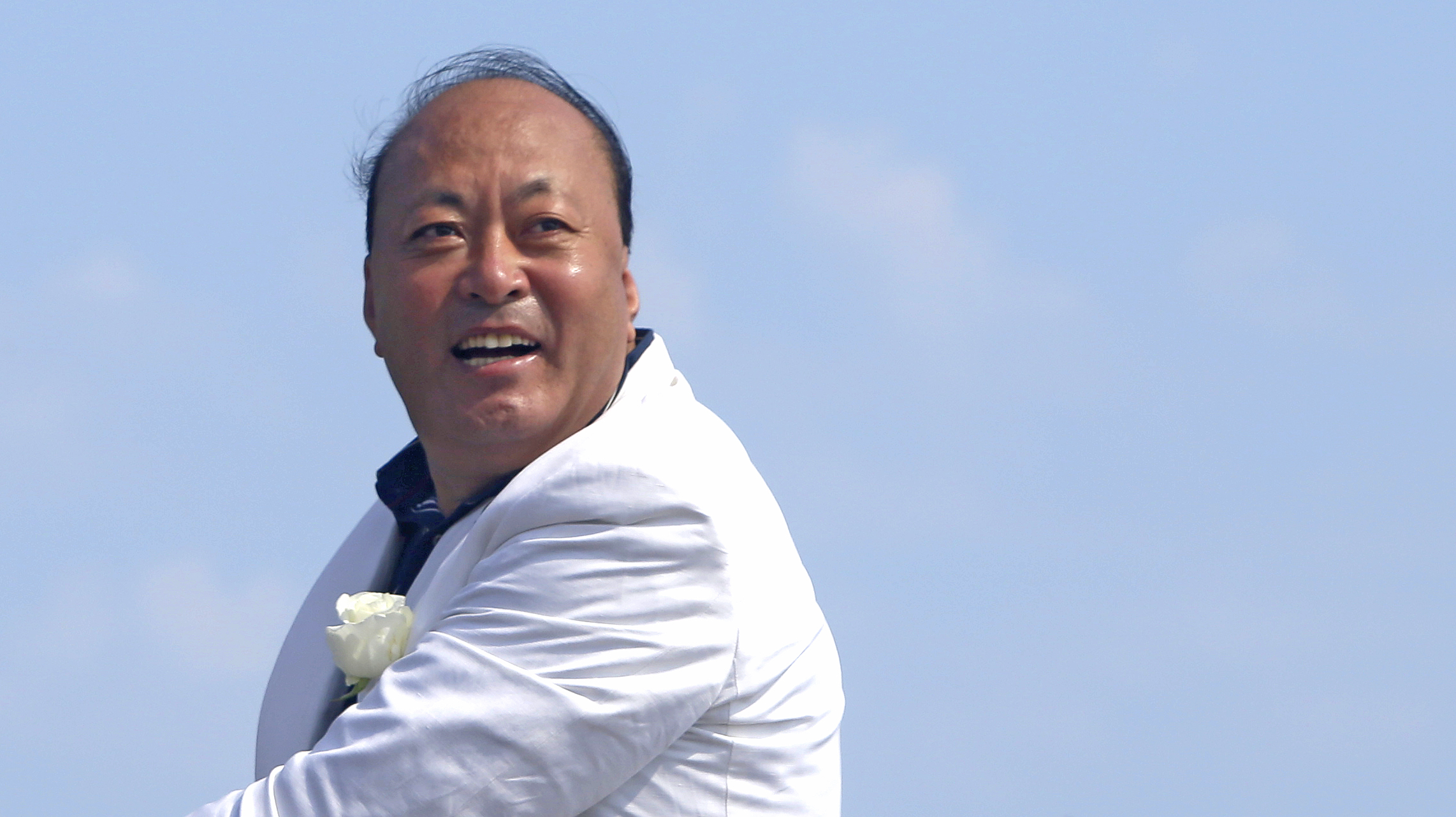 Chinese CEO of "Tiens" company Li Jinyuan poses during a parade on the Promenade des Anglais in Nice, southeastern France May 8, 2015