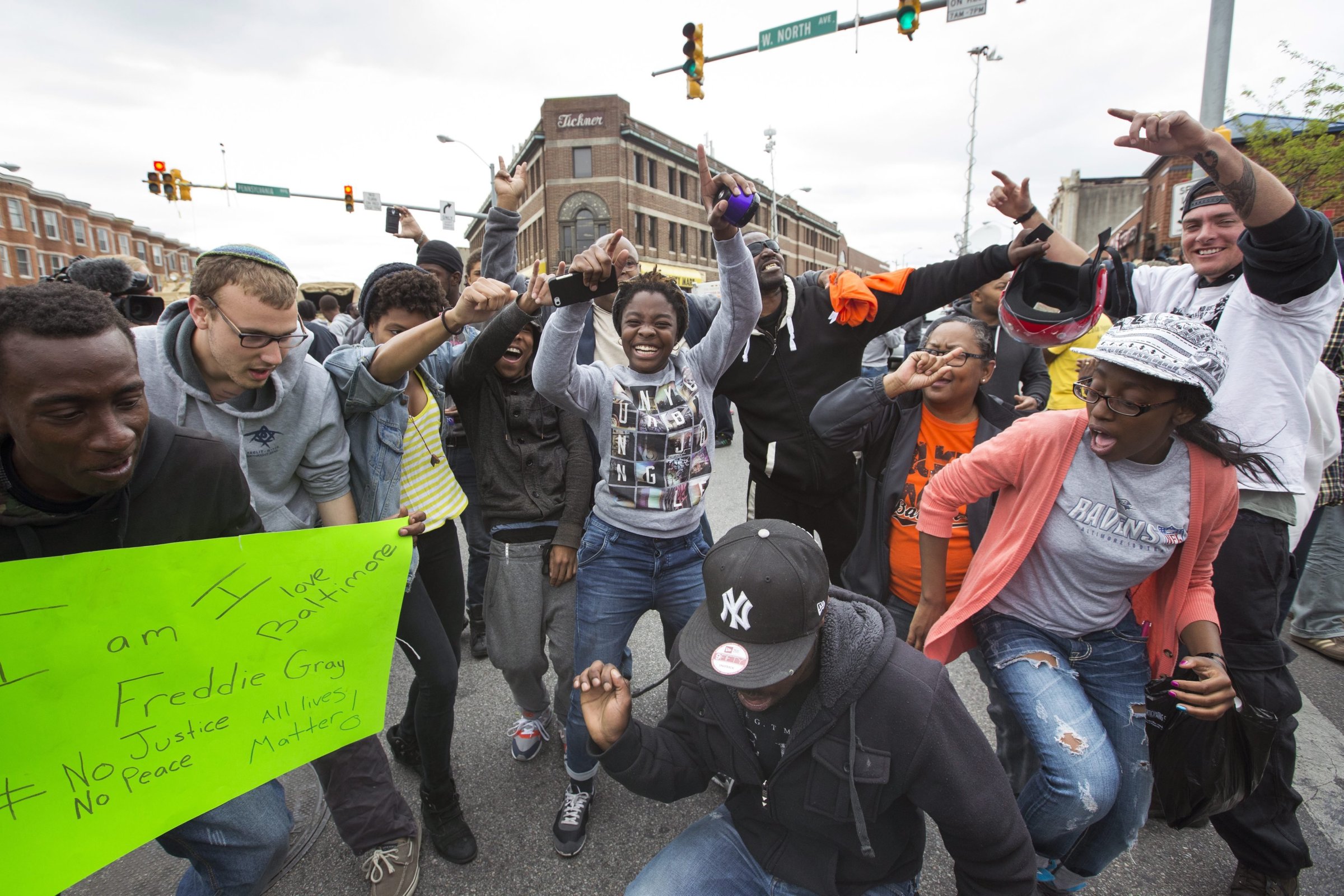 People celebrate in the streets of the Sandtown neighborhood in Baltimore after State Attorney Marilyn Mosby announced that six police officers are being charged in the death of Freddie Gray, in Baltimore on May 1, 2015.