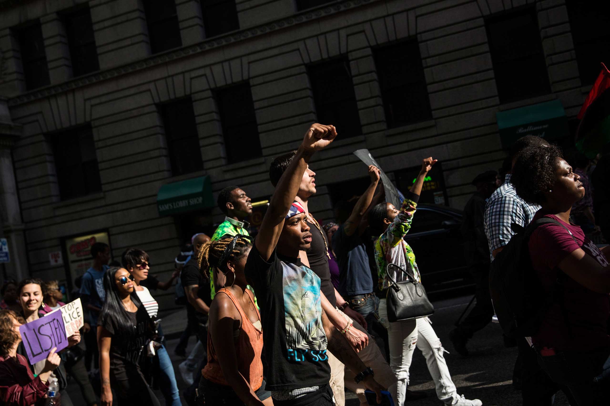 Protesters march from City hall to the Sandtown neighborhood in Baltimore on May 2, 2015. (Andrew Burton—Getty Images)