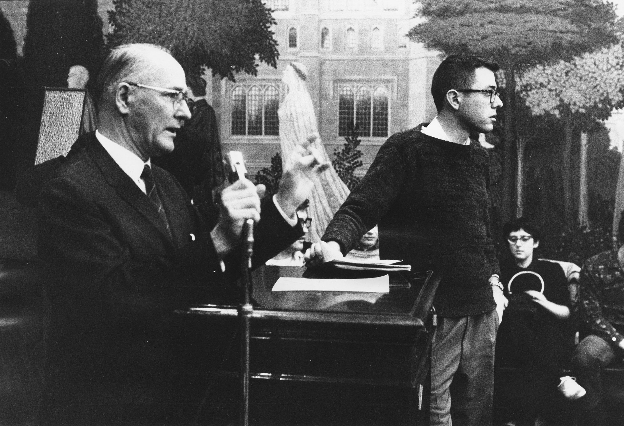 Bernie Sanders (R), member of the steering committee, stands next to George Beadle, University of Chicago president, who is speaking at a Committee On Racial Equality meeting on housing sit-ins. 1962. (Special Collections Research Center/University of Chicago Library)