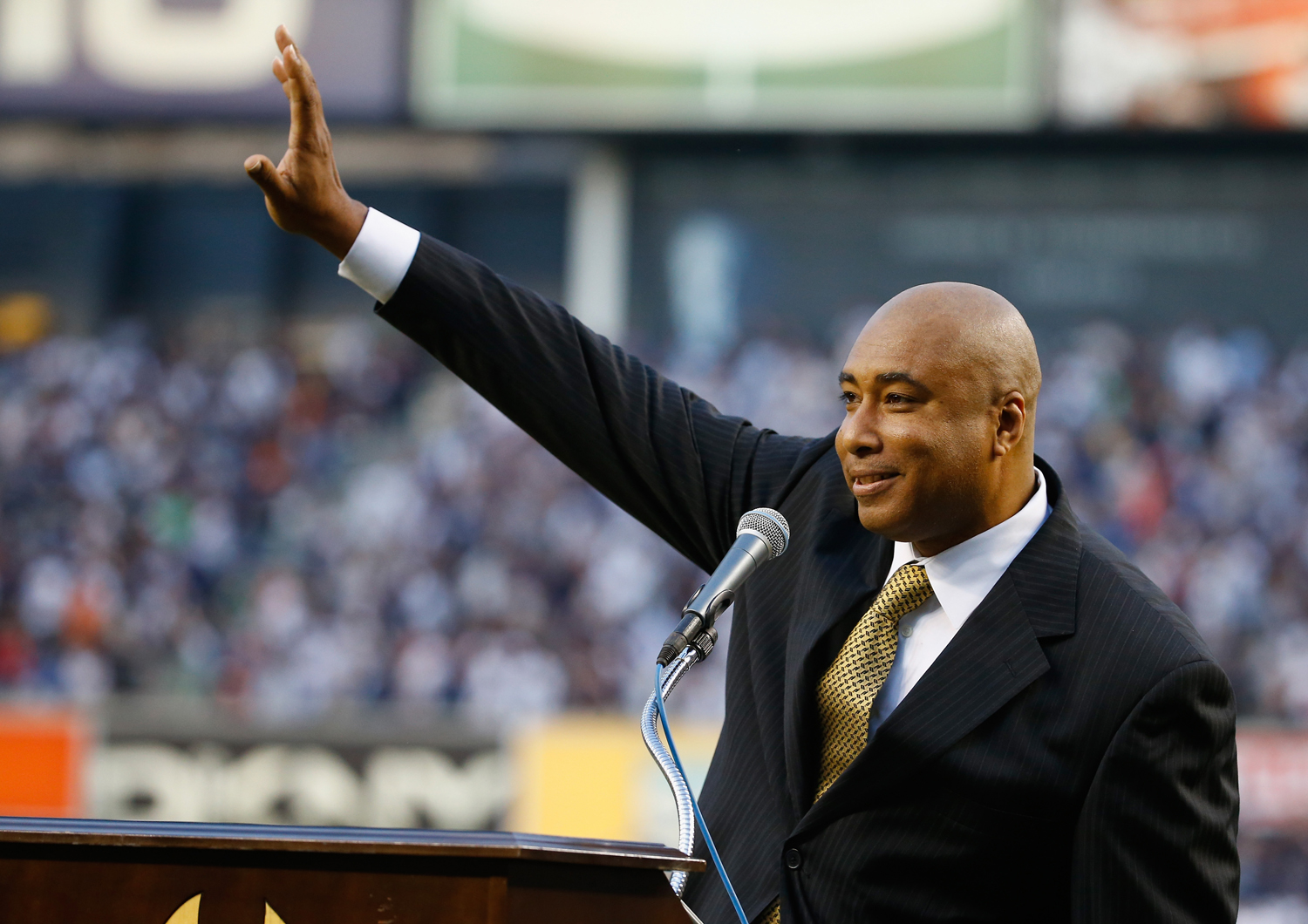 Bernie Williams waves to the crowd during the ceremony to retire his number in Monument Park before the game against the Texas Rangers at Yankee Stadium on May 24, 2015 in New York City. (Al Bello — Getty Images)