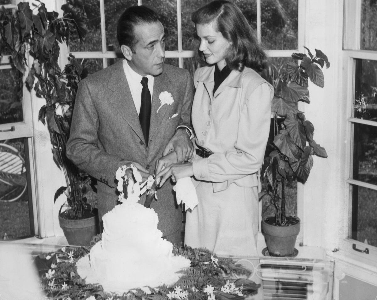Lauren Bacall and Humphrey Bogart cut the cake at their wedding on May 21, 1945 (Hulton Archive / Getty Images)