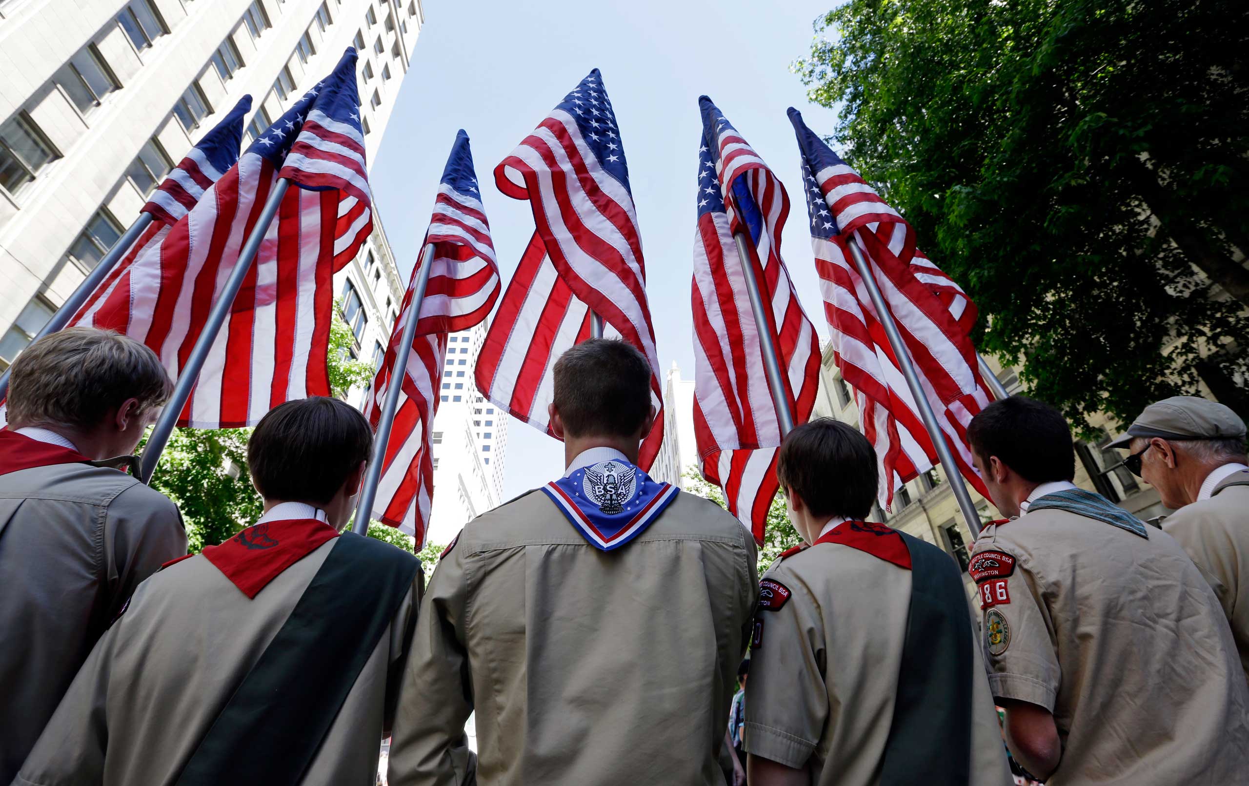 Boy Scouts from the Chief Seattle Council carry U.S. flags as they prepare to march in the Gay Pride Parade in downtown Seattle on June 30, 2013. (Elaine Thompson—AP)