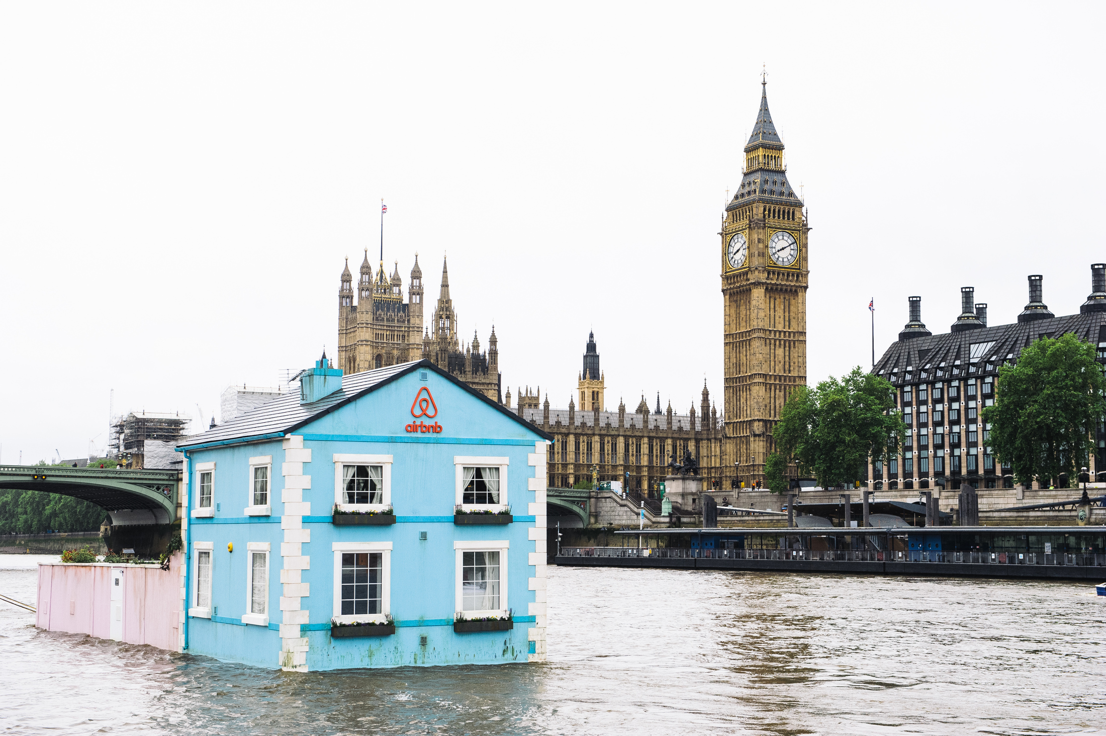 Airbnb's latest London listing is pictured floating down the River Thames, past the Houses of Parliament. (Mikael Buck / Airbnb)