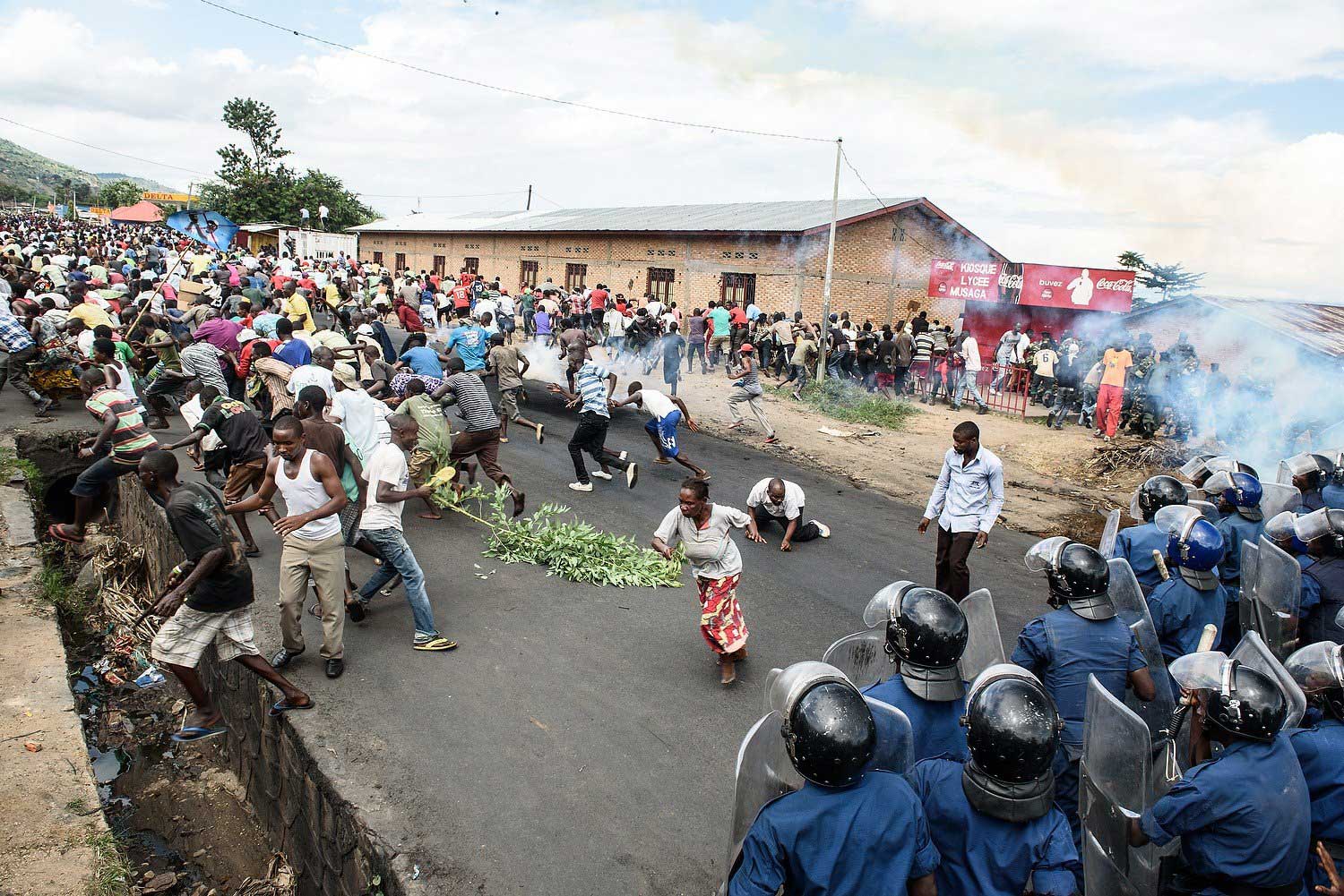 Burundi's policemen and army forces face protestors during a demonstration against incumbent president Pierre Nkurunziza's bid for a 3rd term in Bujumbur on May 13, 2015.