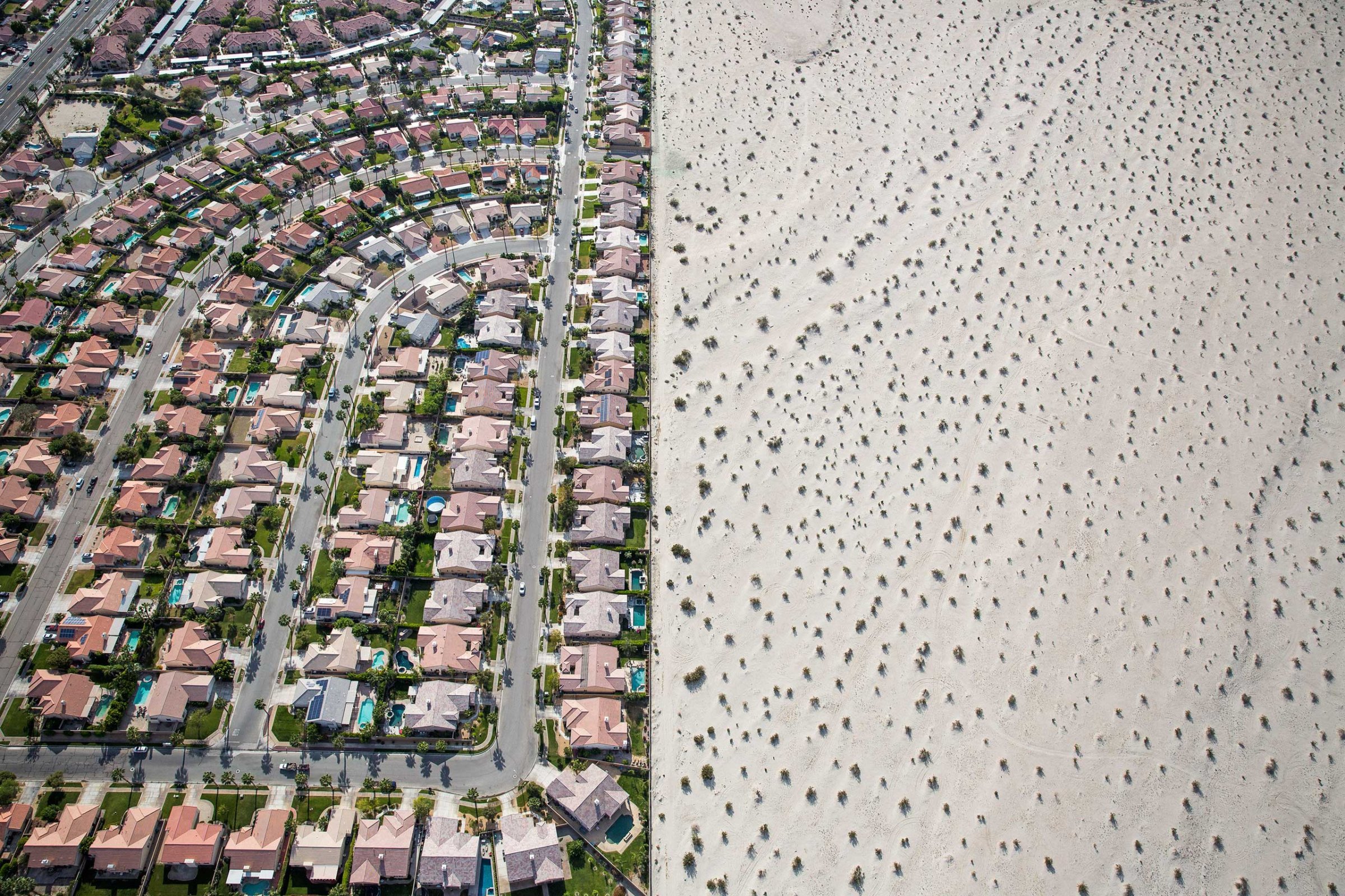 A housing development on the edge of undeveloped desert in Cathedral City, Calif.