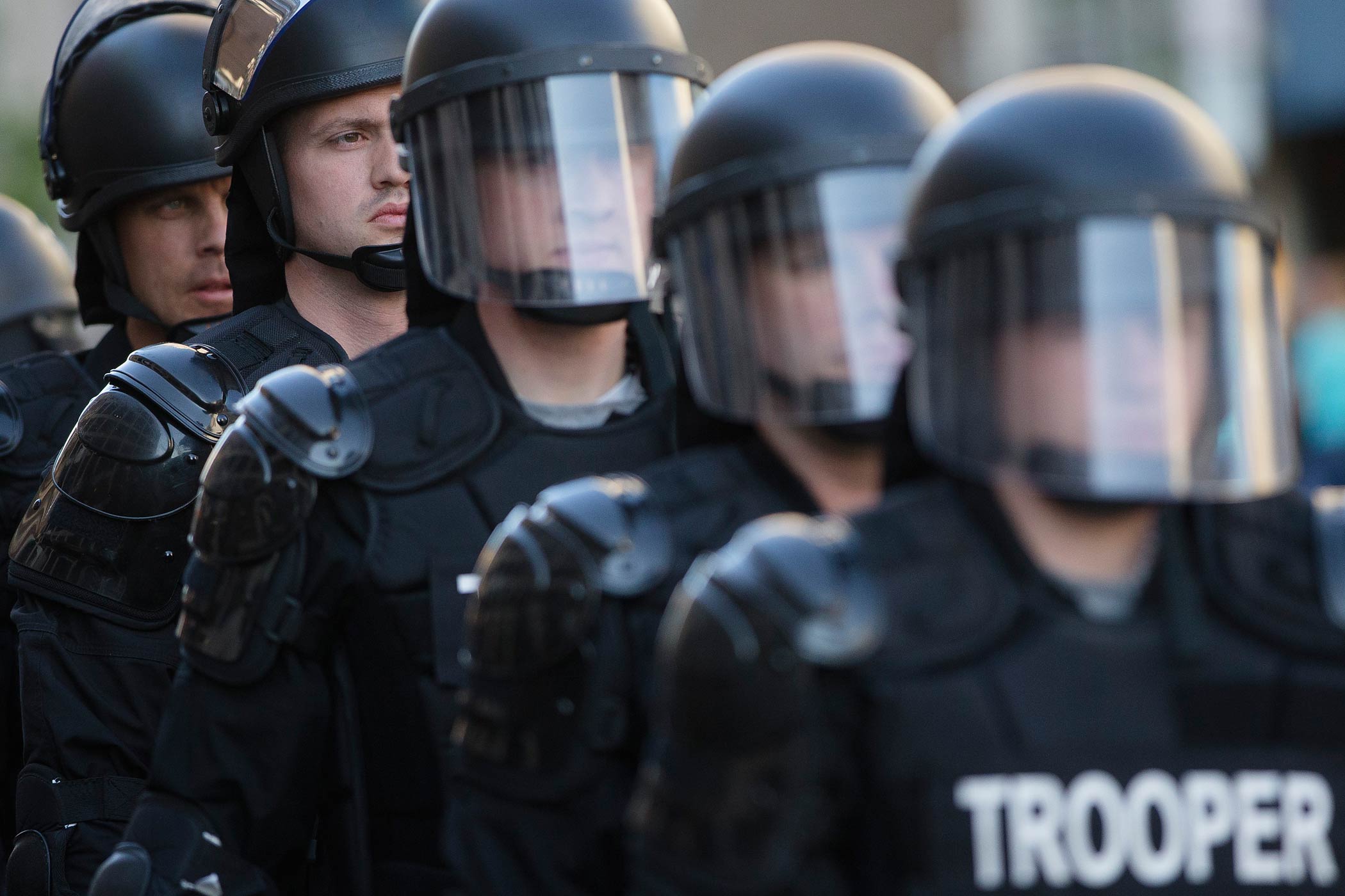 Riot police stand in formation as a protest forms against the acquittal of Michael Brelo, a patrolman charged in the shooting deaths of two unarmed suspects, on May 23, 2015, in Cleveland. (John Minchillo—AP)