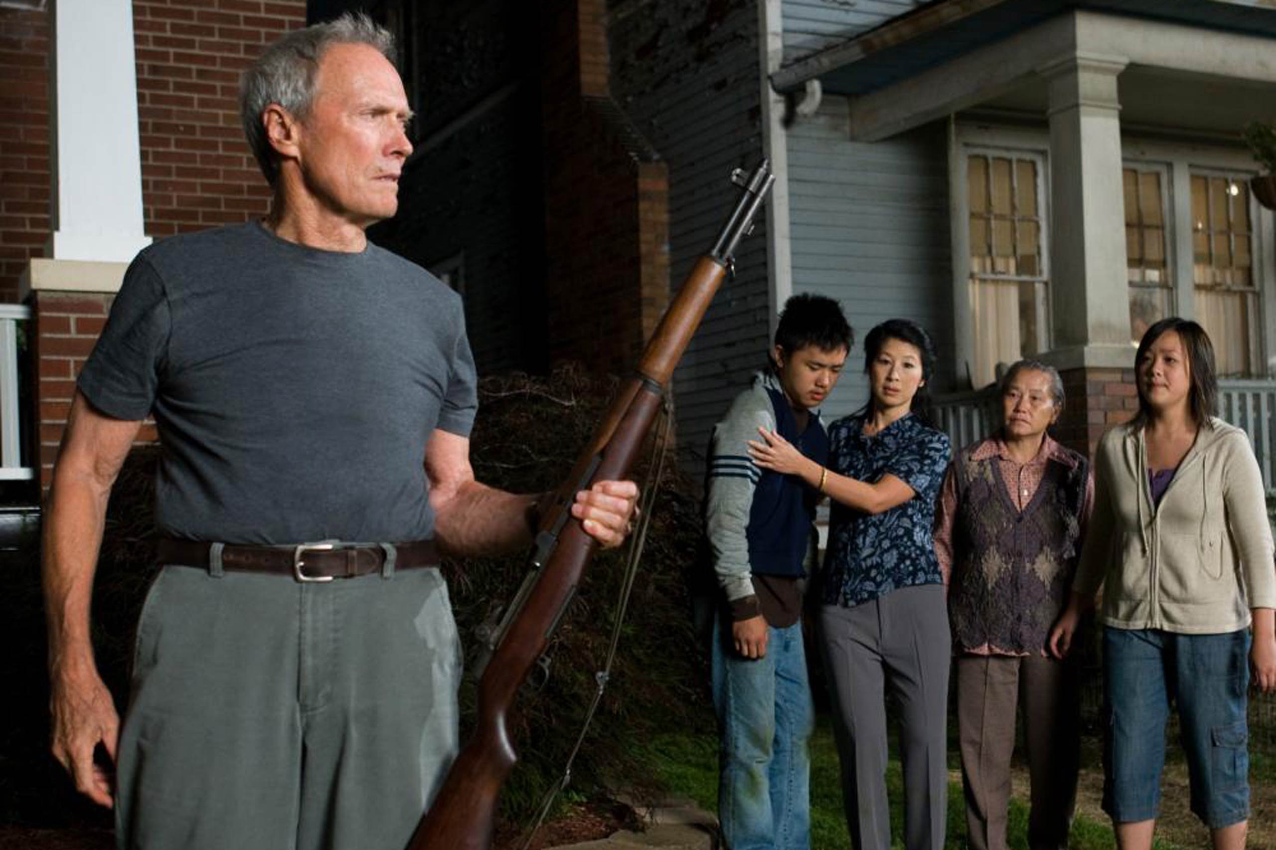 Gran Torino, 2008 The Motion Picture Academy decided to ignore Gran Torino. Yet this small film about an old man softening up to his Hmong neighbors, then steeling himself to avenge a crime committed against them, was the star's biggest hit. Growling and spitting like a distempered stray, his Walt Kowalski is a mass of gruff prejudices against the minorities who've moved into his Michigan town. When some kids brawl in front of his house, he brandishes a rifle and actually shouts,  Get off my lawn!  Underneath, though, Walt is a stalwart man of the Midwest — the hero who has a score to settle. With himself. Eastwood the director puts Eastwood the actor is in total command of his character, daring himself to new depths. You'll see a tough man cry — one of the few flourishings of tears in the Eastwood oeuvre. That unaffected emotion eventually informs the whole movie, making it a wrenching, rewarding experience. Along with his famous guts, Dirty Harry has a heart.
