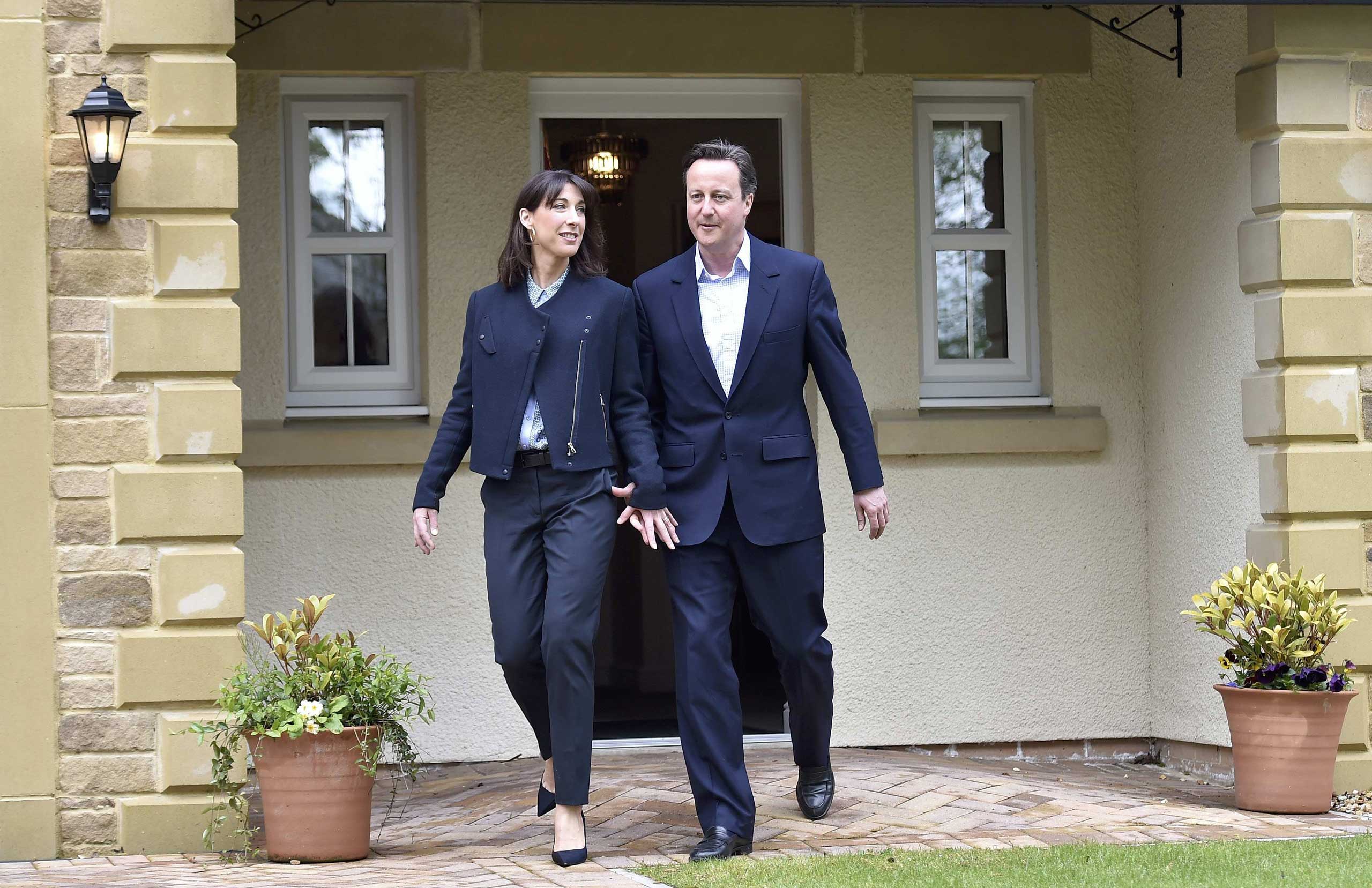 Prime Minister David Cameron and his wife Samantha during a campaign visit to a home-building scheme on May 6, 2015, in Lancaster, England (Toby Melville—WPA Pool/Getty Images)