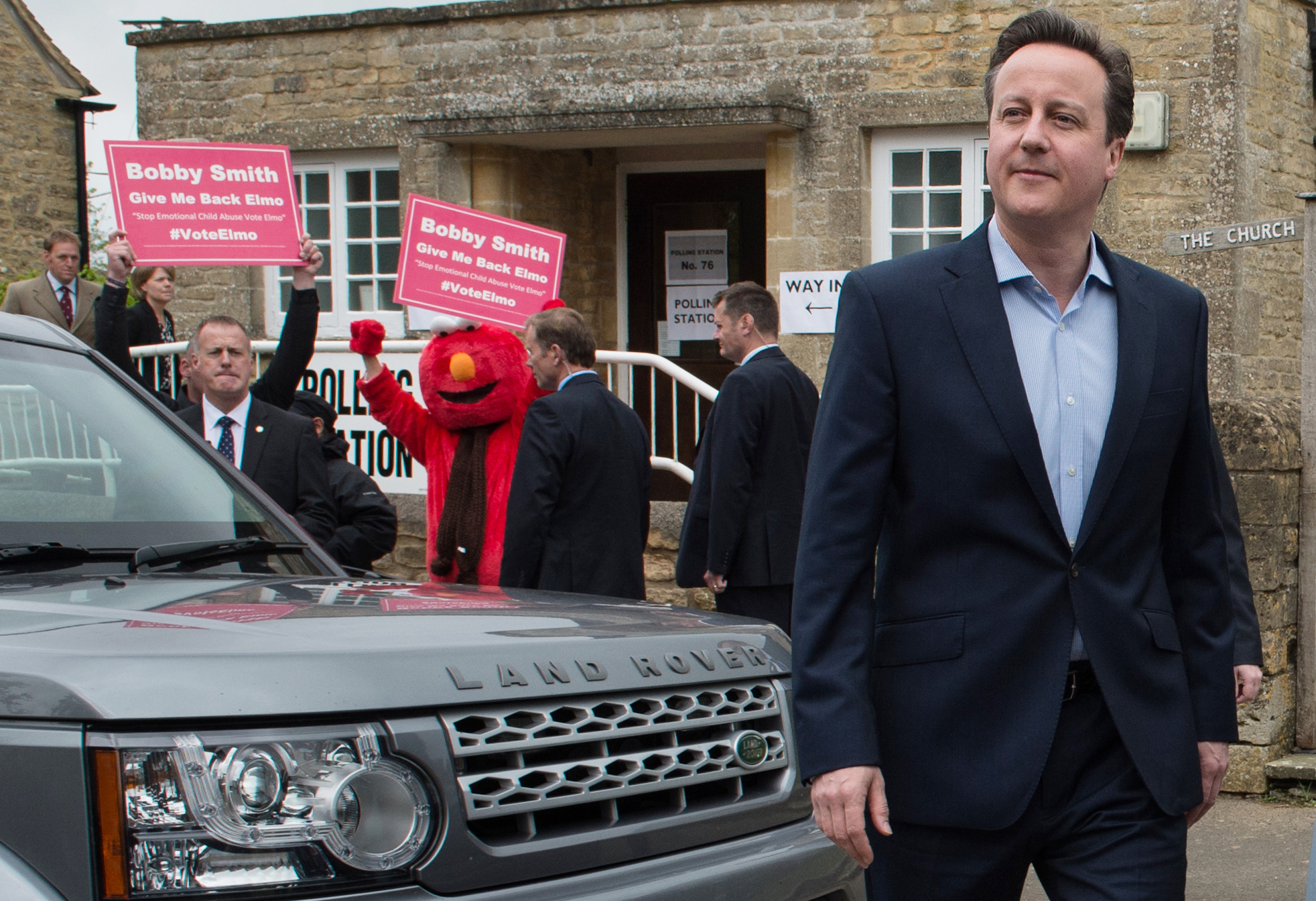 Britain's Prime Minister and Conservative Party leader David Cameron leaves the polling station after voting in Spelsbury, England, in the general election on May 7, 2015.