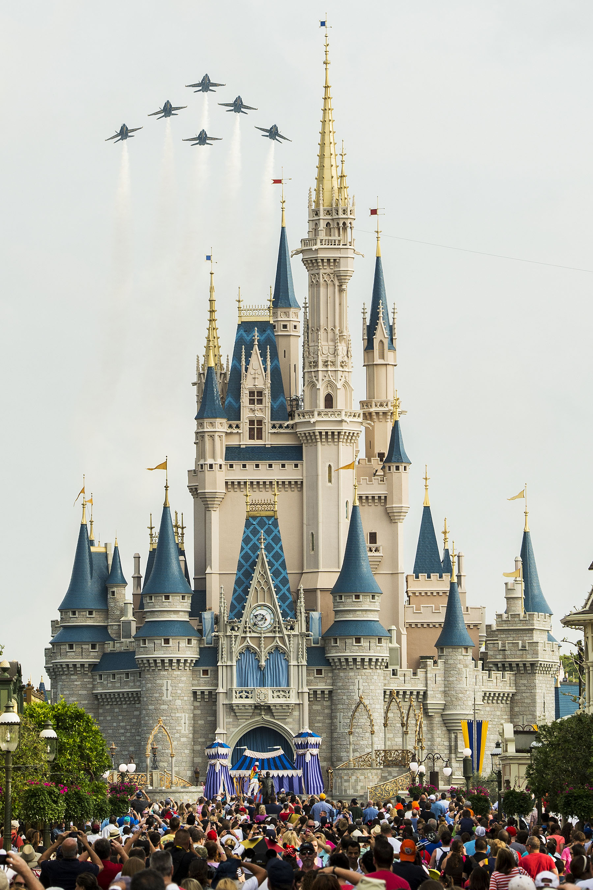 In this handout photo provided by Disney Parks, in a special moment for Magic Kingdom guests, the U.S. Navy Flight Demonstration Squadron, the Blue Angels, streaked across the skies above Cinderella Castle March 19, 2015 at Walt Disney World Resort in Lake Buena Vista, Florida.  The flyover featured the Blue Angels' six-jet F/A-18 Hornet Delta Formation making two dramatic passes above the Magic Kingdom, with Cinderella Castle as a focal point, en route to an air show in Florida. (Matt StroshaneHandout&amp;mdash;Disney Parks/Getty Images)