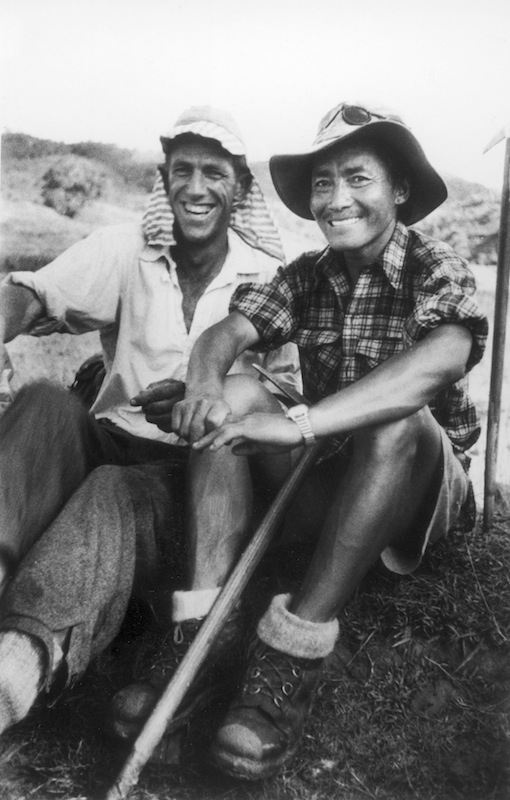 Edmund Hillary and Nepalese sherpa guide Tenzing Norgay sitting together after the pair became first to scale Mount Everest (James Burke—The LIFE Picture Collection/Getty Images)