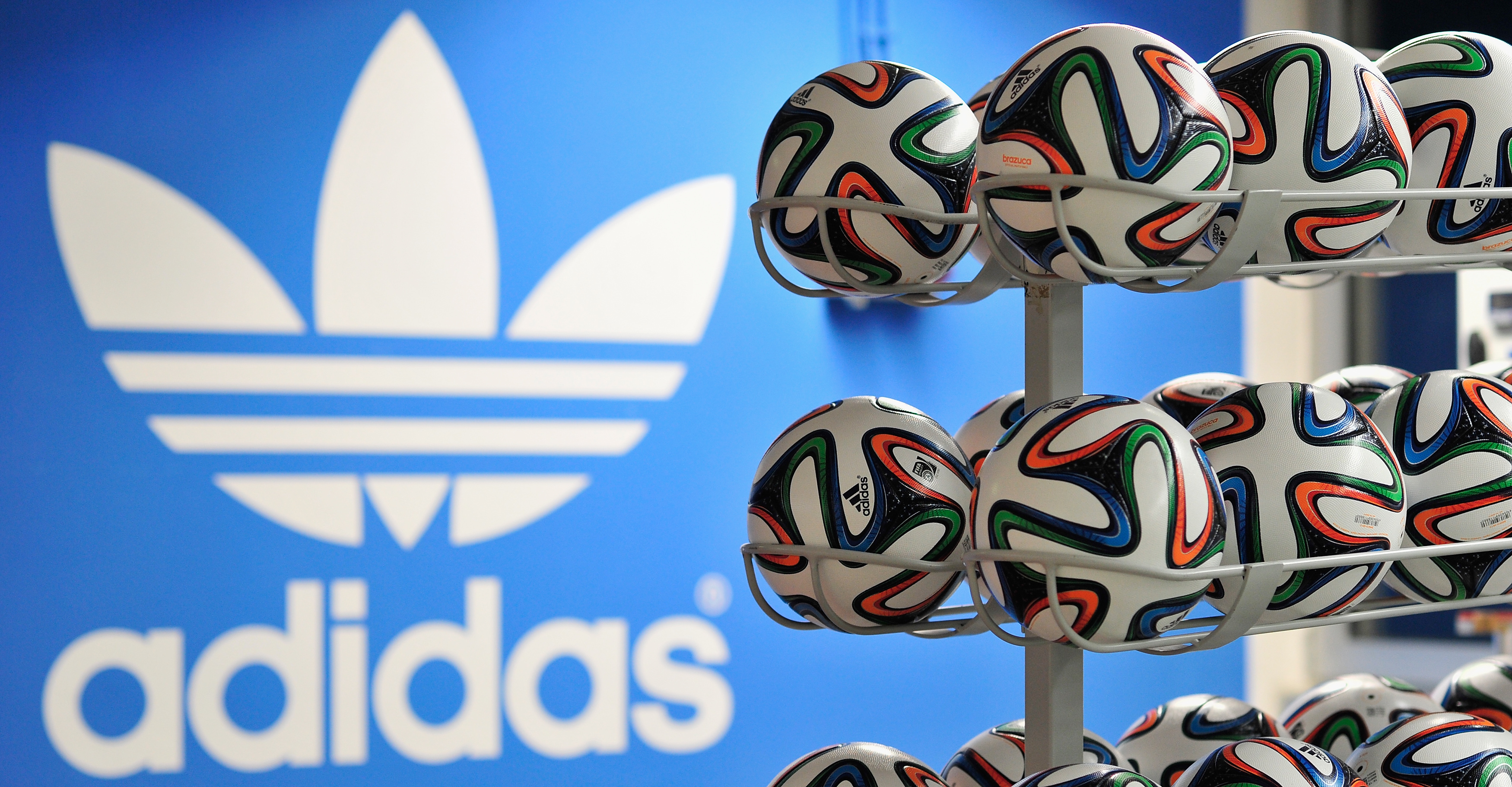 Brazuca match balls for the FIFA World Cup 2014 lie in a rack in front of the adidas logo on December 6, 2013 in Scheinfeld near Herzogenaurach, Germany. (Lennart Preiss&mdash;Getty Images for adidas)