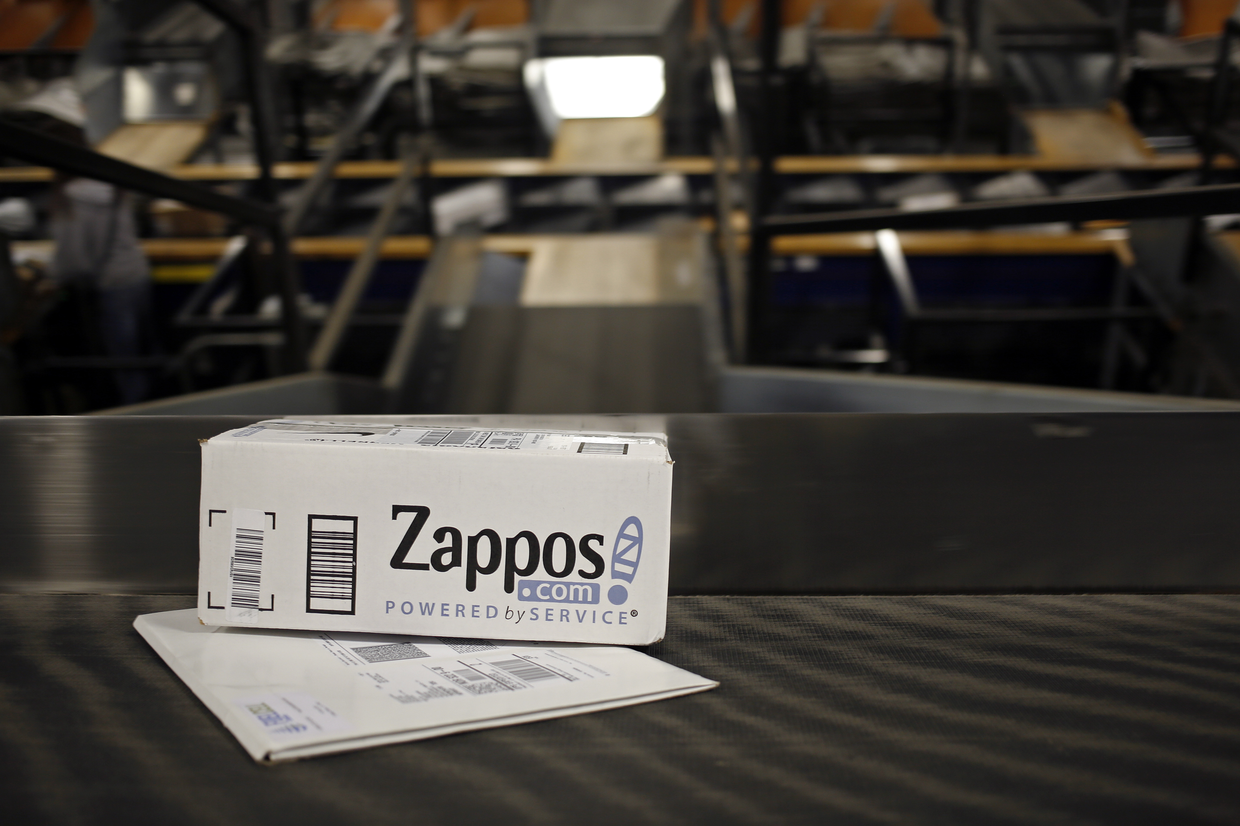 A package from Zappos.com moves down a conveyor belt during the afternoon sort at the United Parcel Service Inc. (UPS) Worldport facility in Louisville, Kentucky, U.S., on Tuesday, April 21, 2015. (Bloomberg&mdash;Bloomberg via Getty Images)