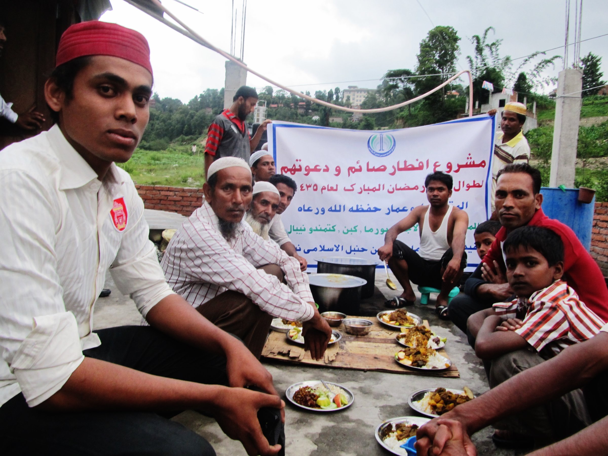 Hassan Hassan, left, and other Rohingya refugees on the outskirts of Kathmandu, Nepal