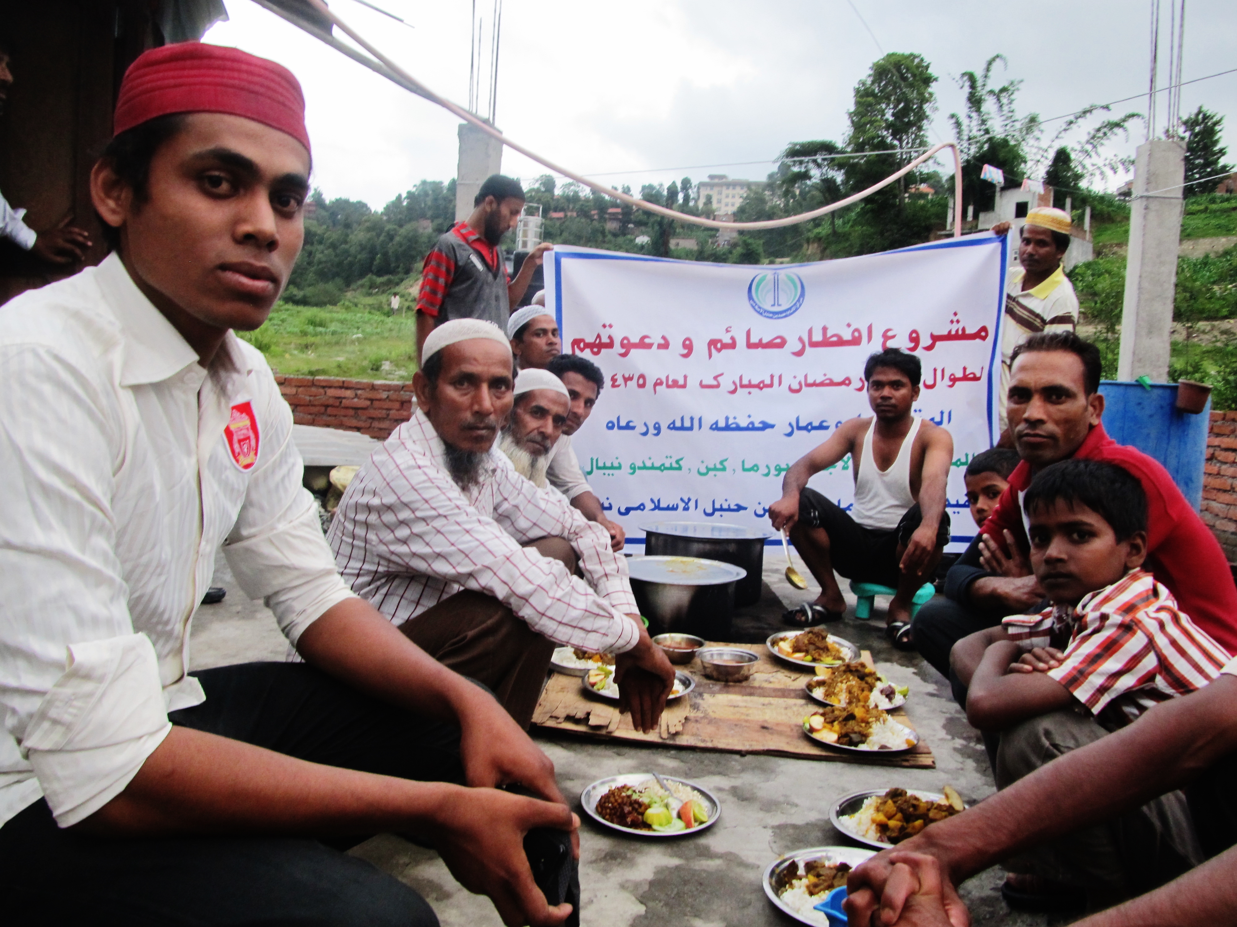Hassan Hassan, left, with fellow Rohingya refugees on the outskirts of Kathmandu in July 2014 (Sabrina Toppa for TIME)