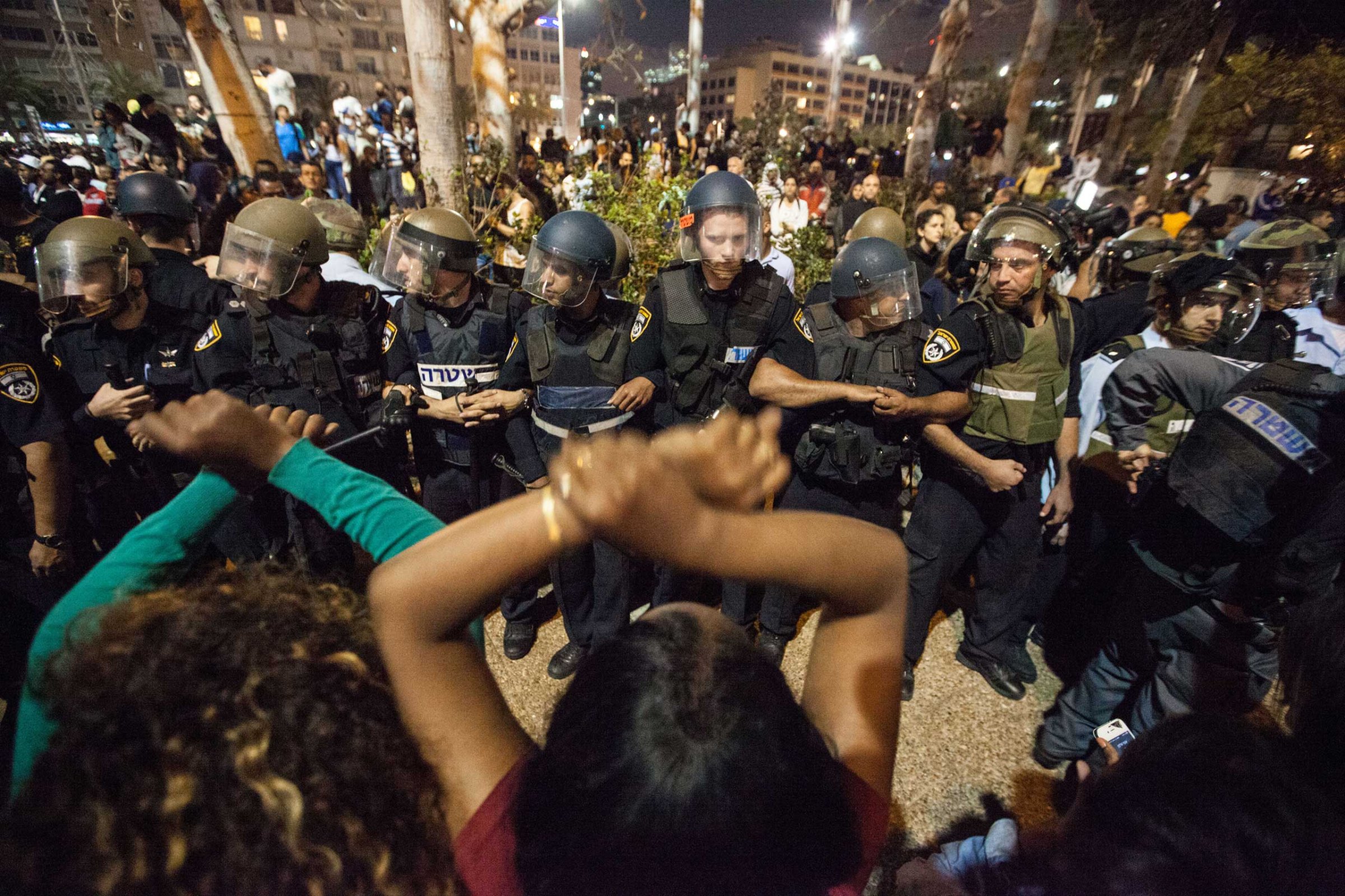 Demonstrators confront Israeli policemen, during a demonstration of Ethiopian Jews at RABIN Square in Tel Aviv on May 3, 2015.