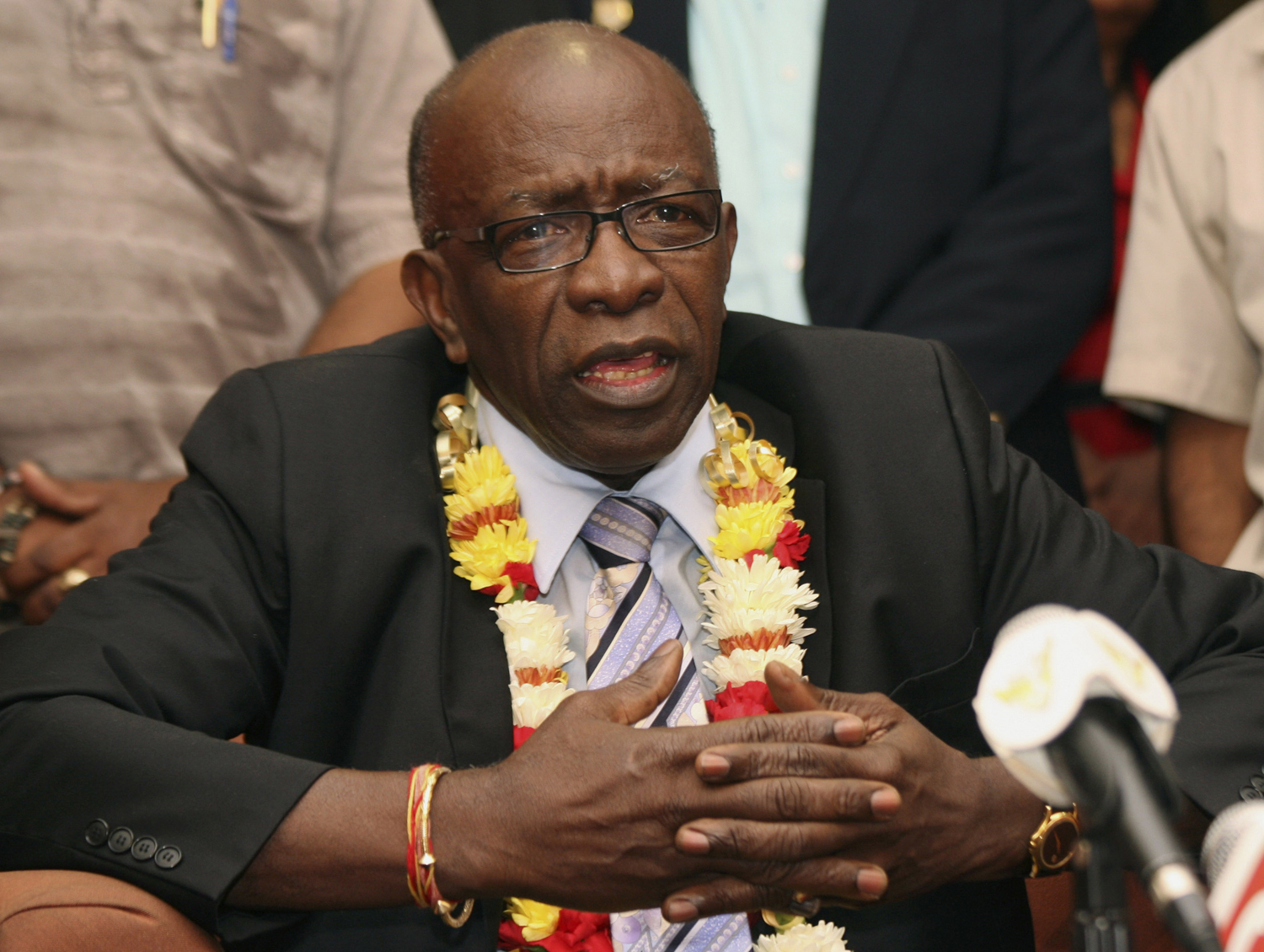 FIFA executive Jack Warner gestures during a news conference held shortly after his arrival at the airport in Port-of-Spain, in his native Trinidad and Tobago on June 2, 2011. (Shirley Bahadur — AP)