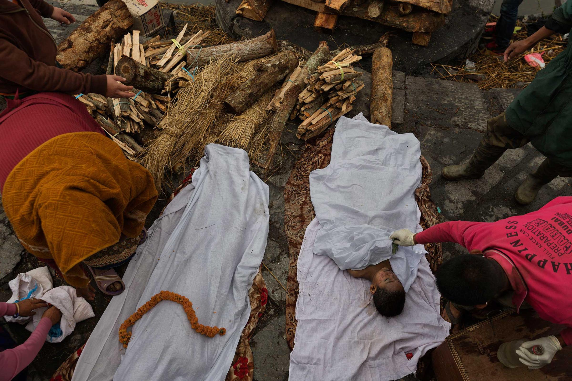Nepal earthquake. Hindu funeral cremation rituals at Pashupatinath Temple on the Bagmati River in Katmandu. by James Nachtwey