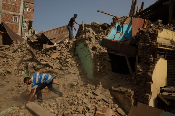 Nepal earthquake. Town of Sankhu. Mush of town was destroyed. People digging out their possessions. by James Nachtwey
